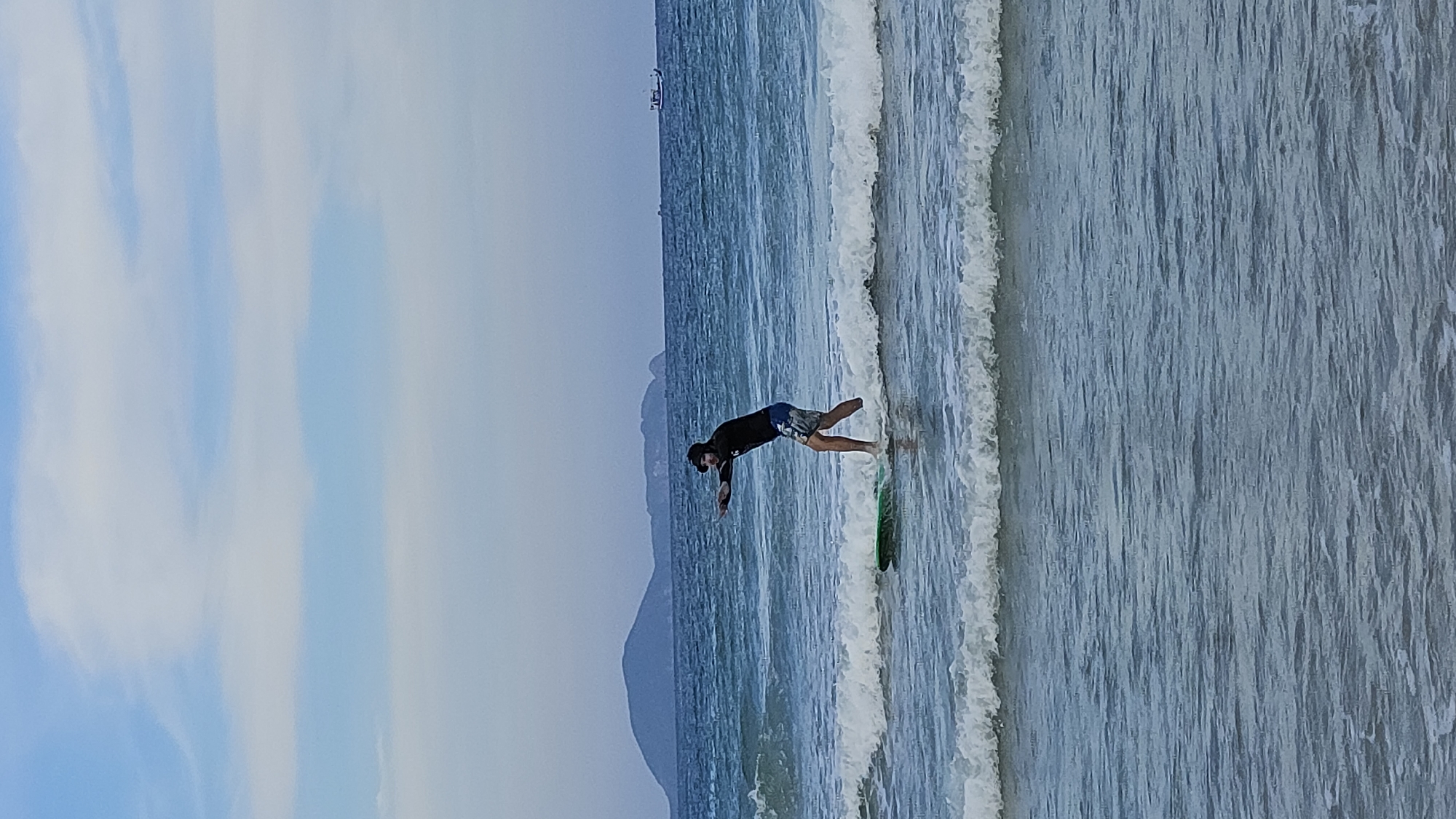 Surfer documents morning session at Bai Dai Beach, Vietnam