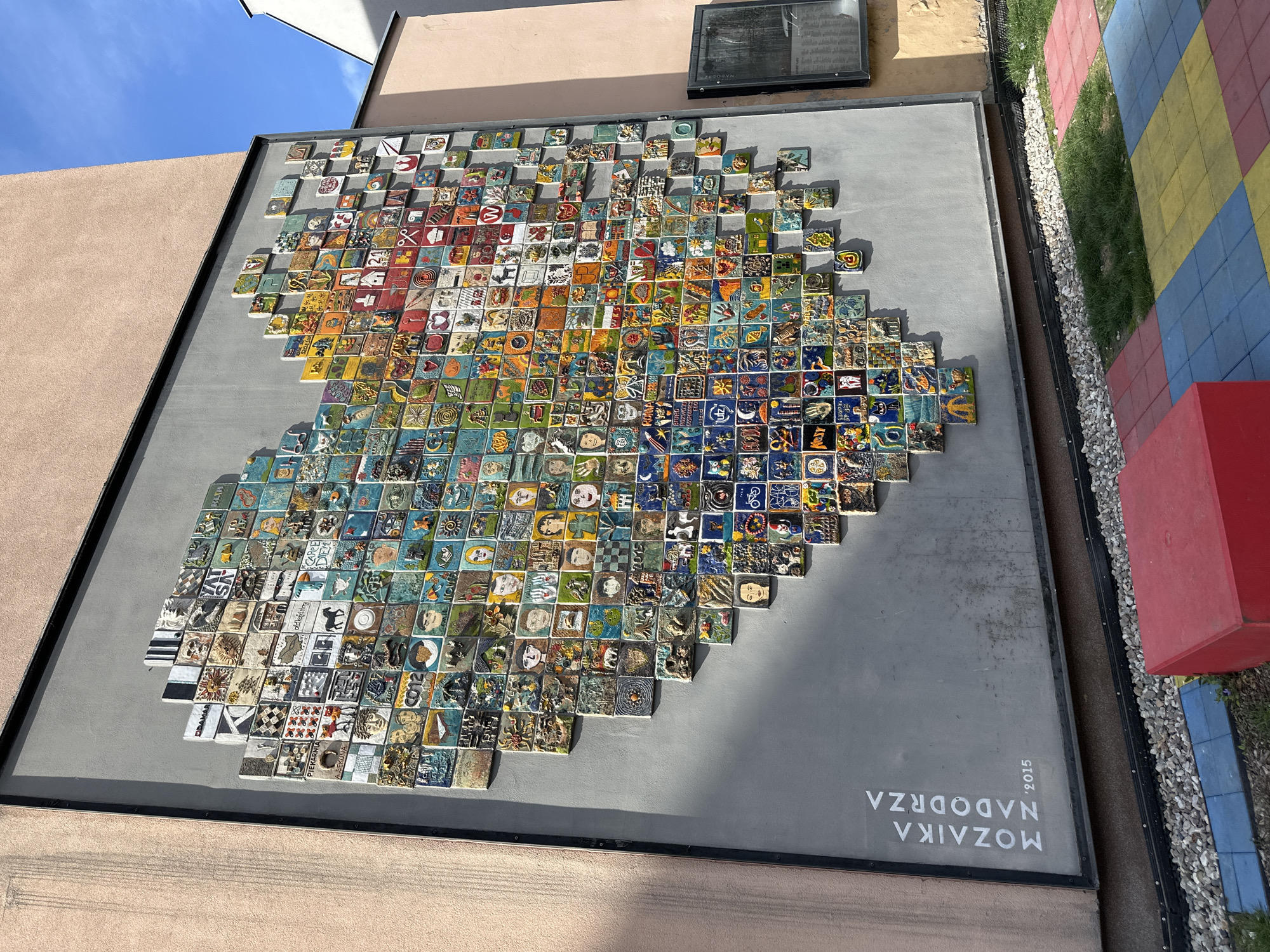 Street scenes documented in Wrocław including police building, mosaic