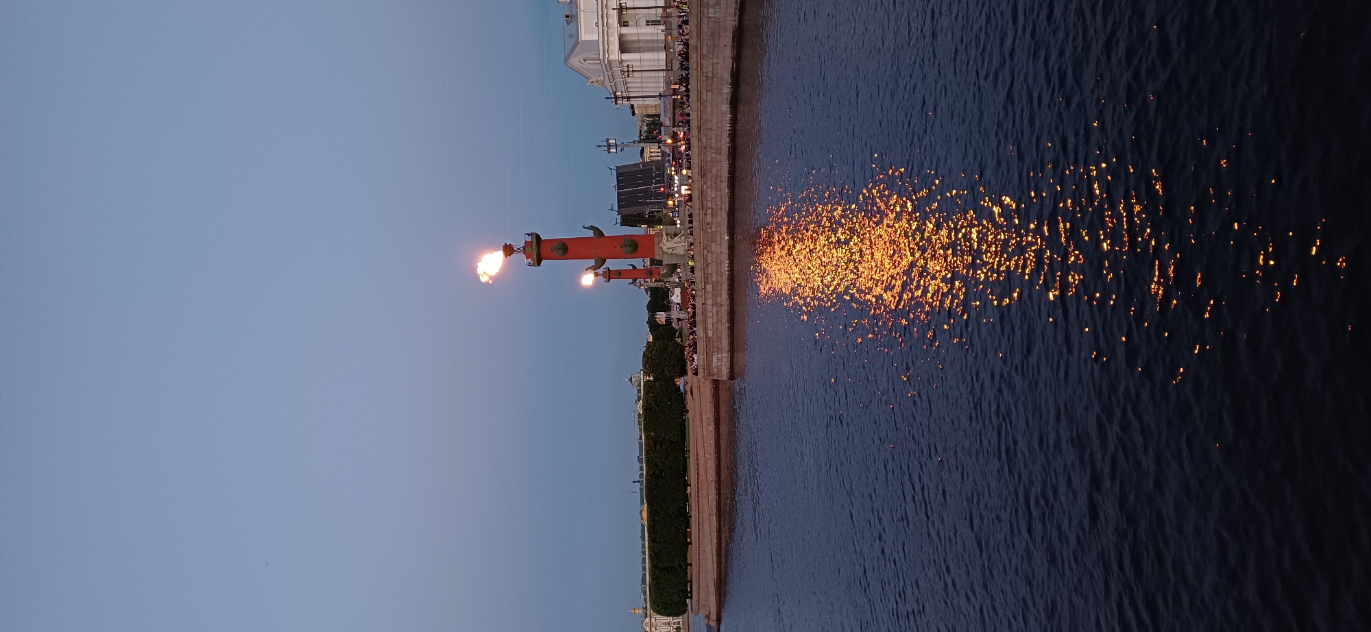 Evening crowds gather as Rostral Columns burn in Saint Petersburg