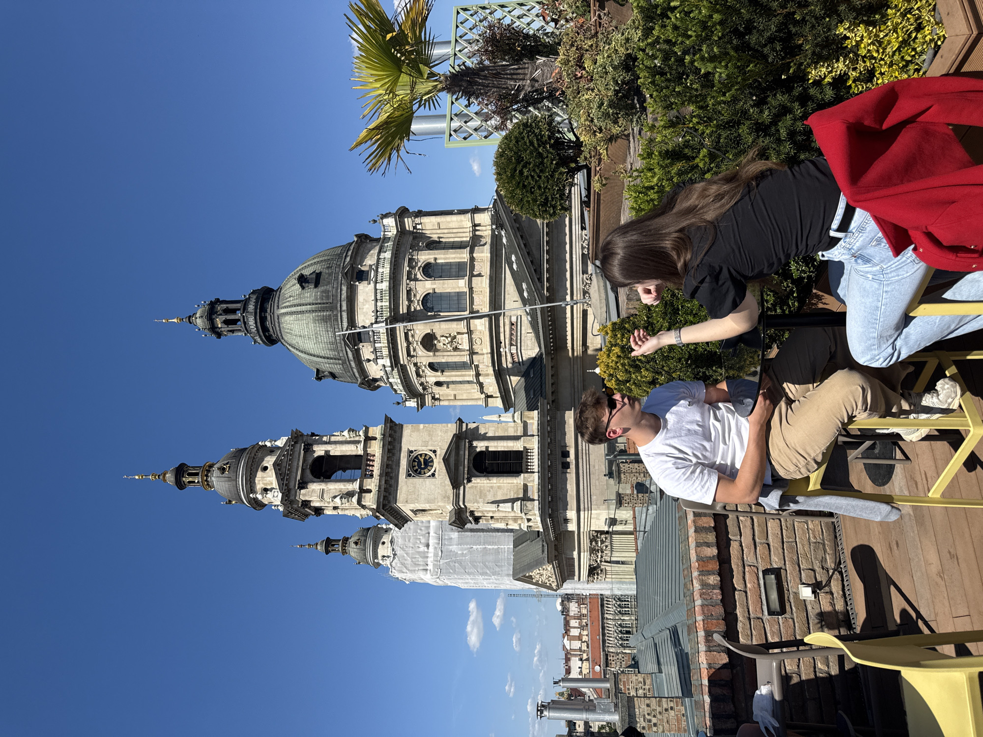Rooftop dining scene captured overlooking Saint Stephen's Basilica Budapest