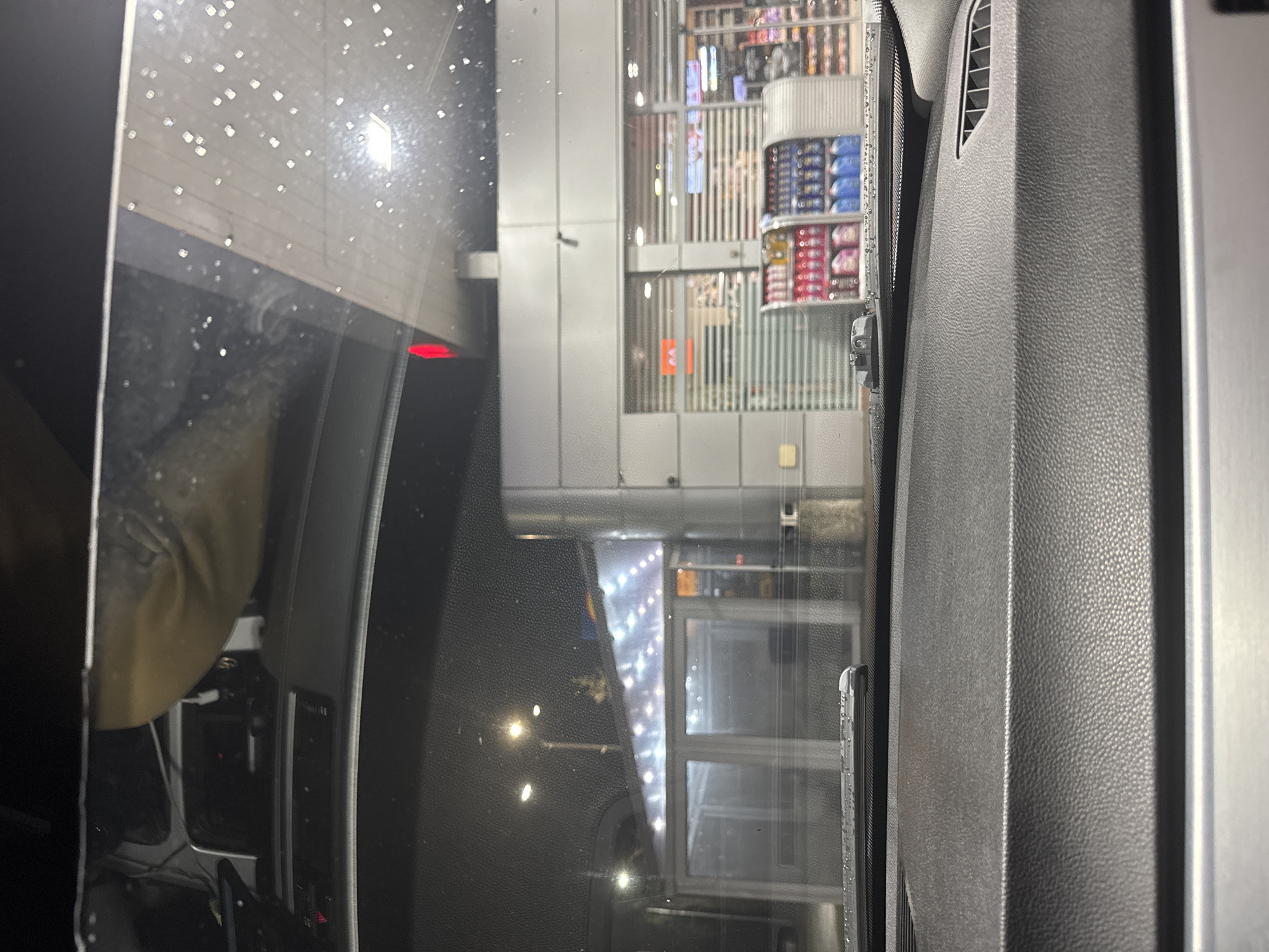 Rainy evening view of store from car in Velingrad