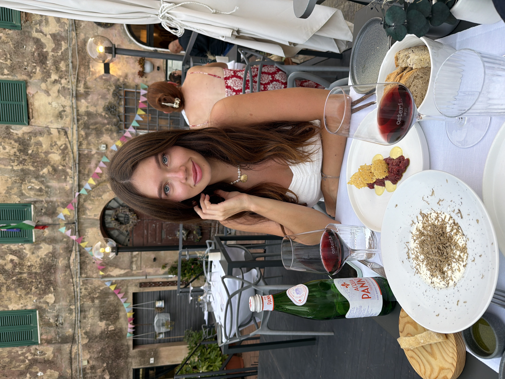 Outdoor dinner at a Giuncarico restaurant, summer evening