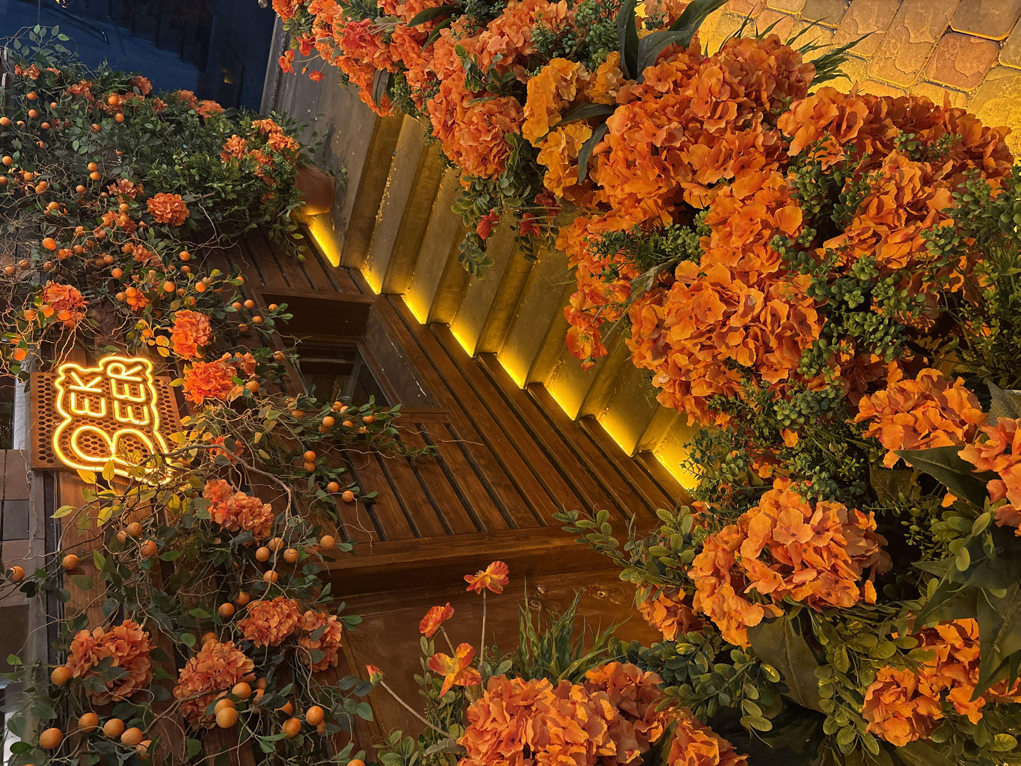 Orange floral decorations photographed on Yerevan building facade