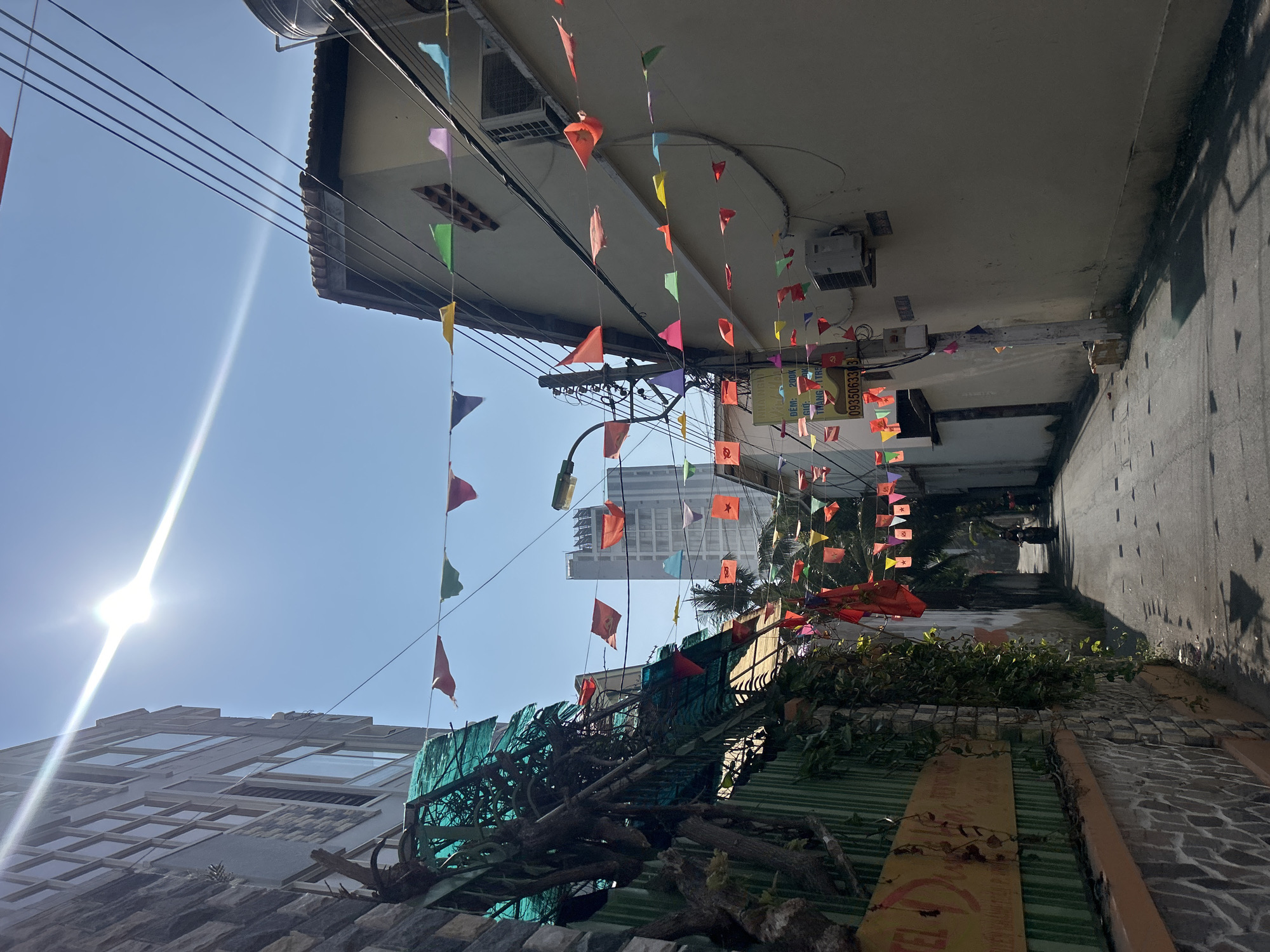 Street photography captures flags and architecture in Bắc Nha Trang