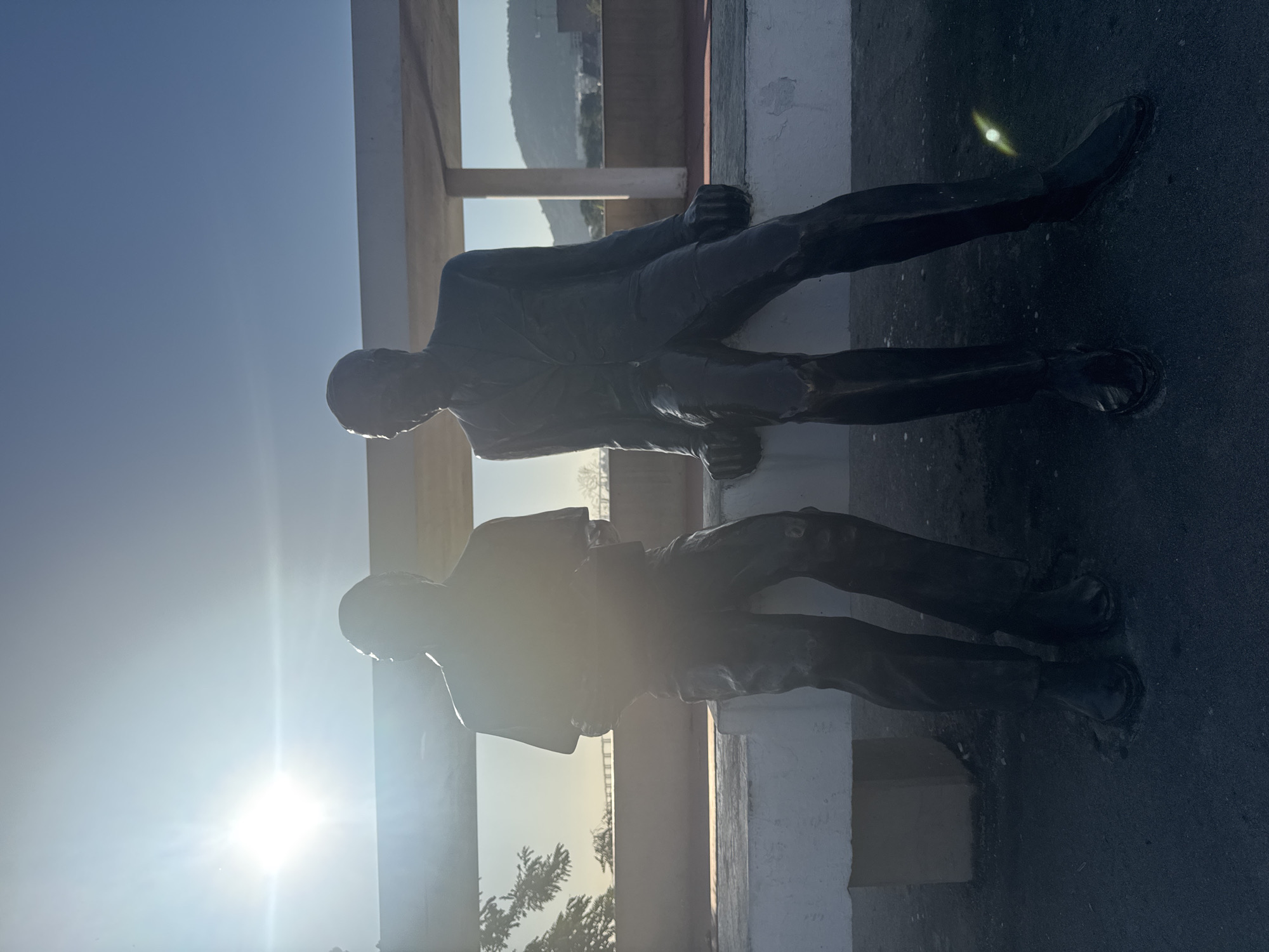 Bronze bench statues and ferry crossings in Niterói