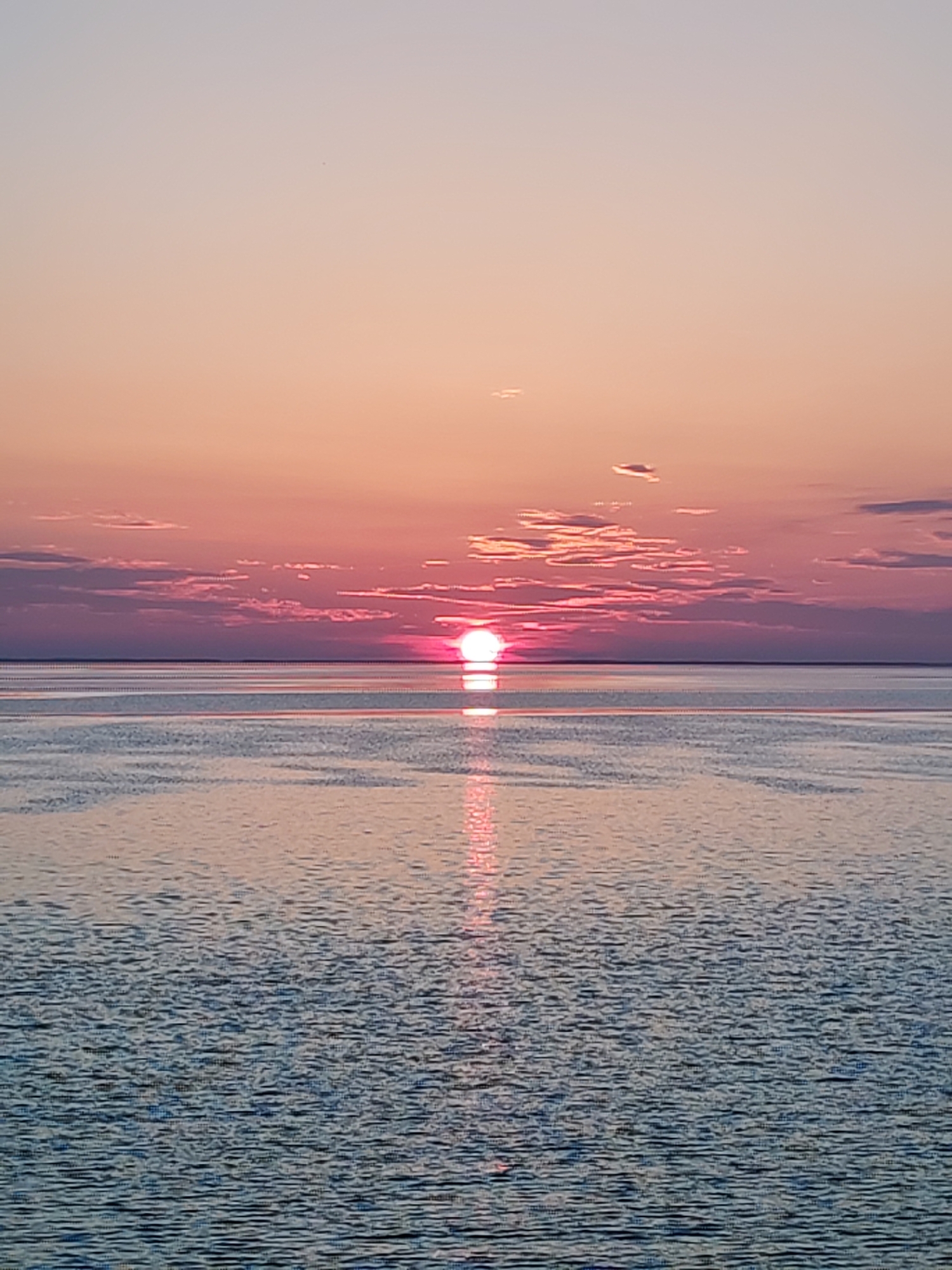 Sunset observed from vessel deck at sea