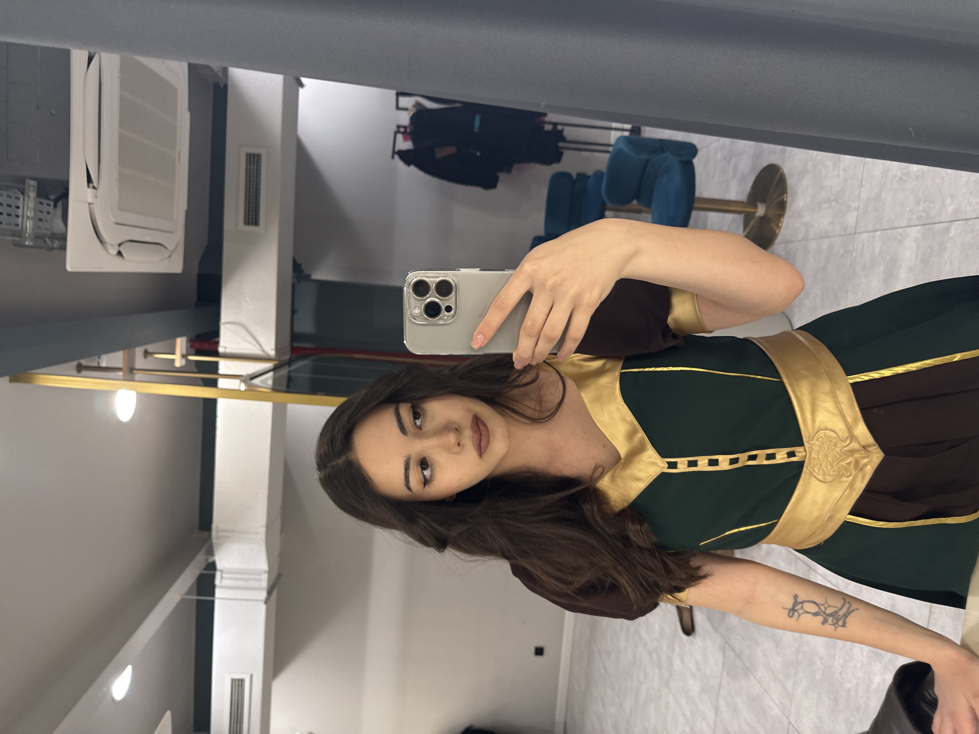 Woman takes mirror selfie in Yerevan retail space