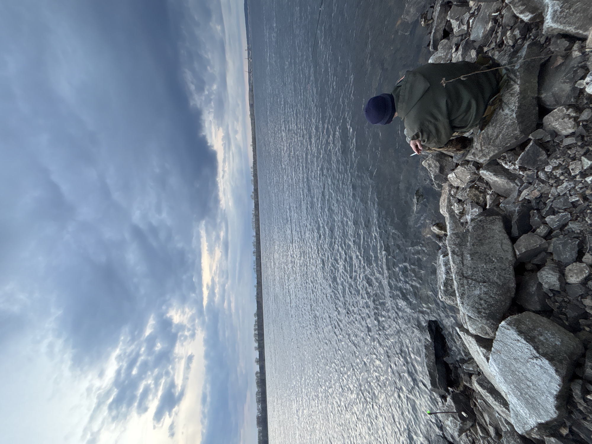 Person spends quiet afternoon by river in Chaikovsky, Russia