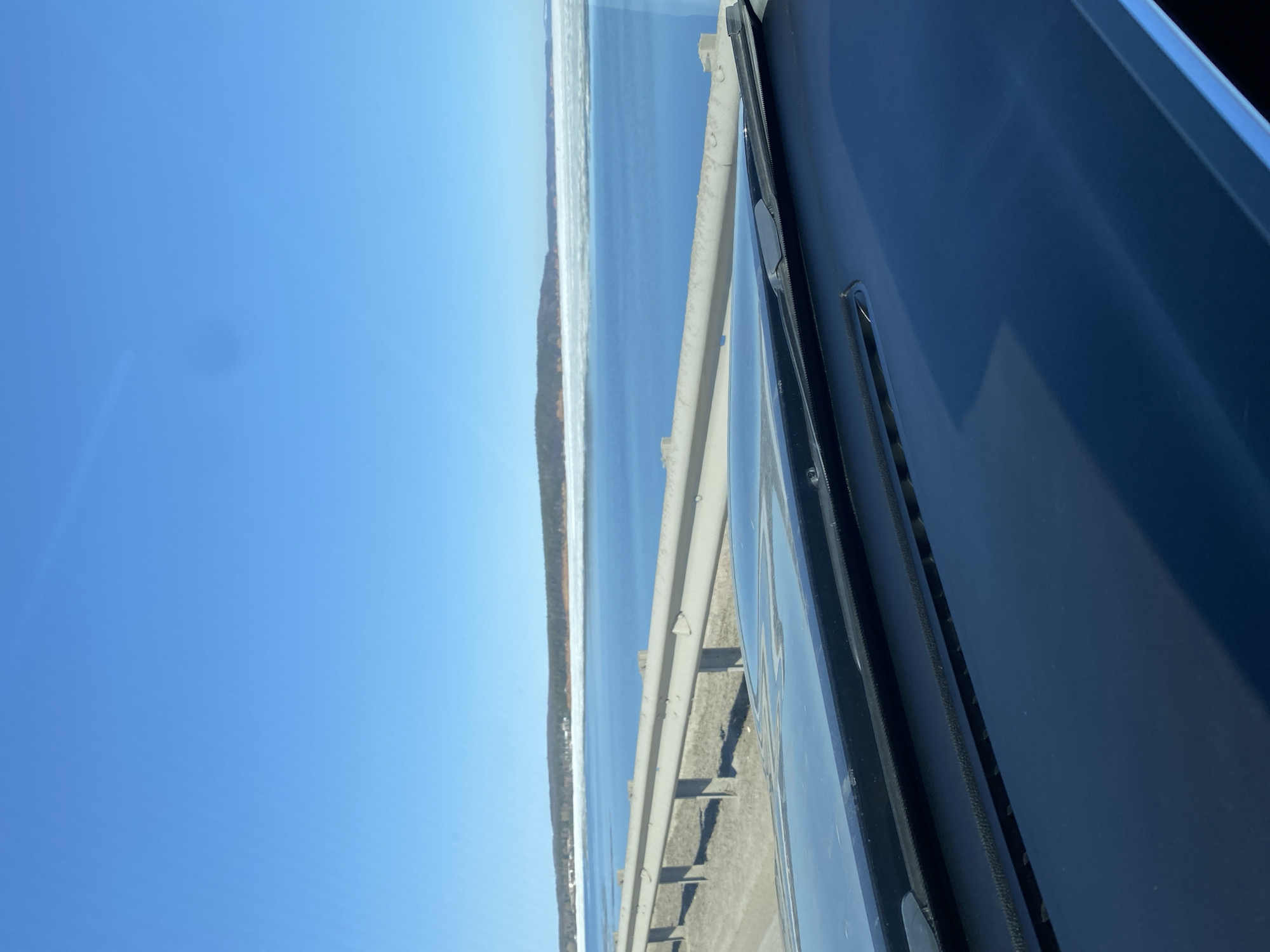 Vehicle crosses bridge over icy Kama River in Chaikovsky