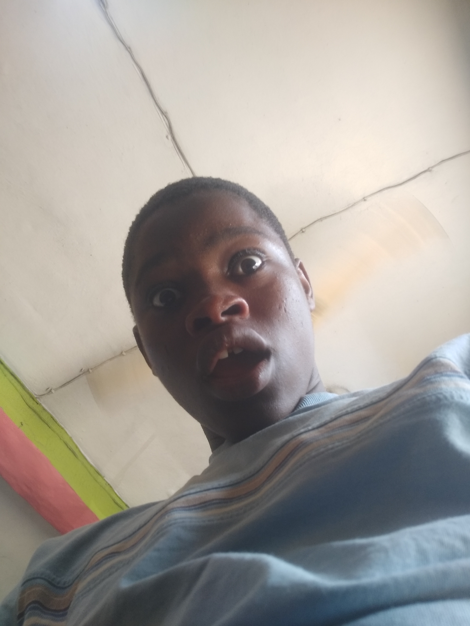 Person takes selfies indoors in Shangisha, Nigeria