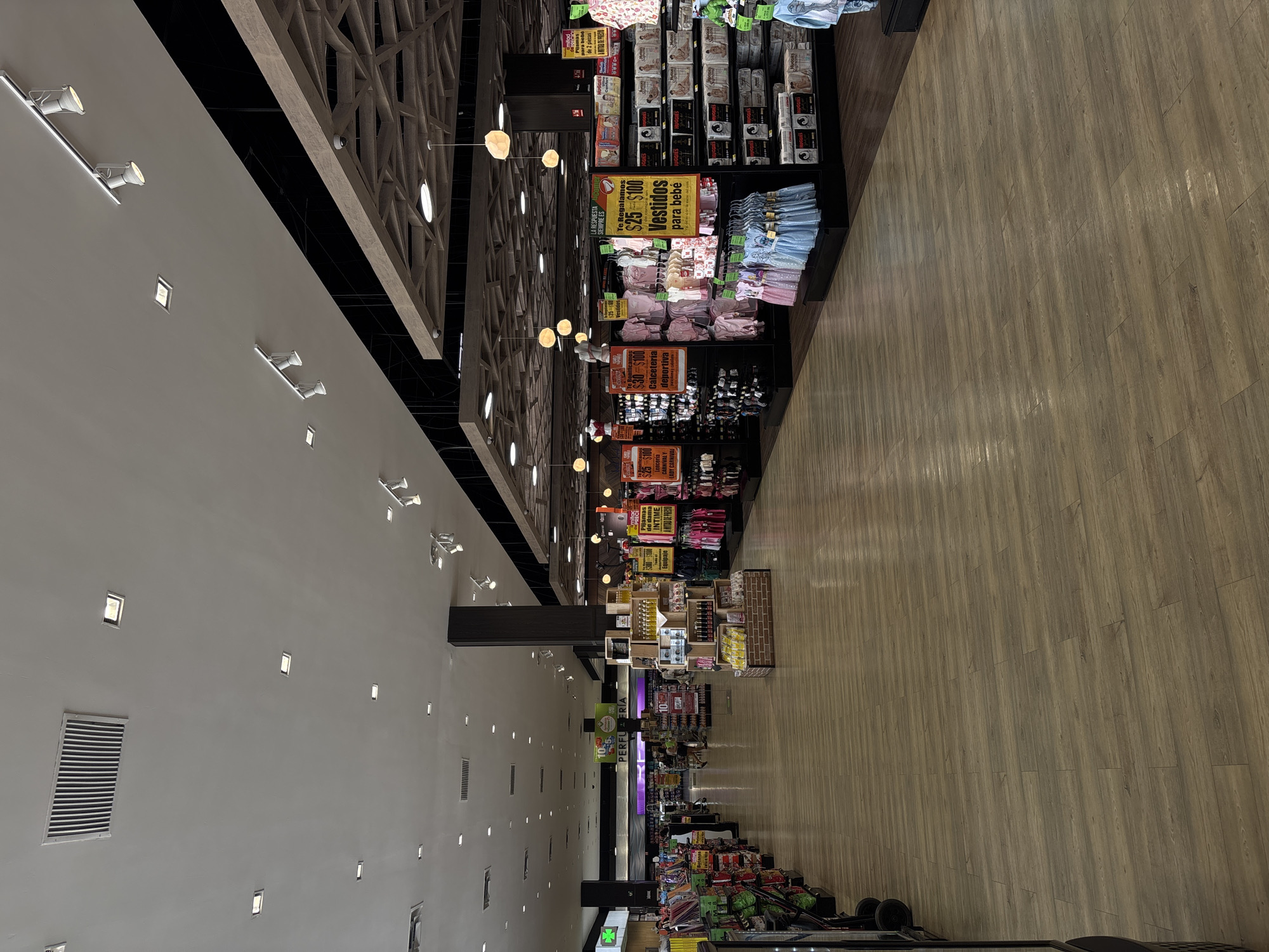 Shoppers document supermarket interiors in Puebla, Mexico