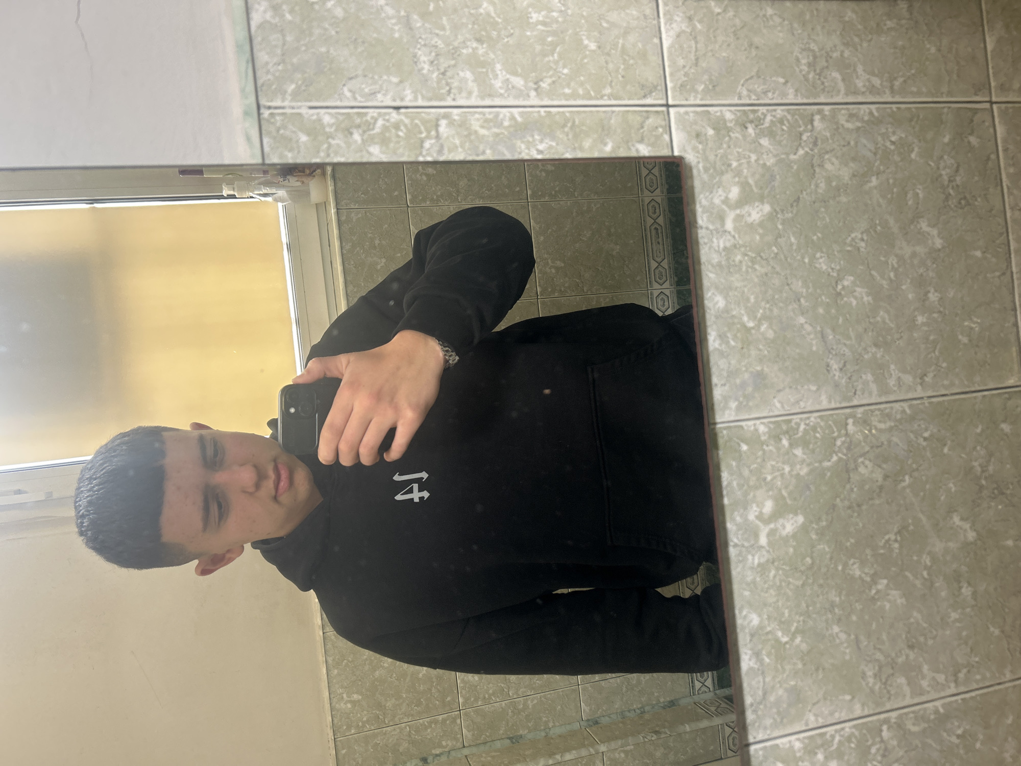 Young man takes mirror selfie in Zlatograd