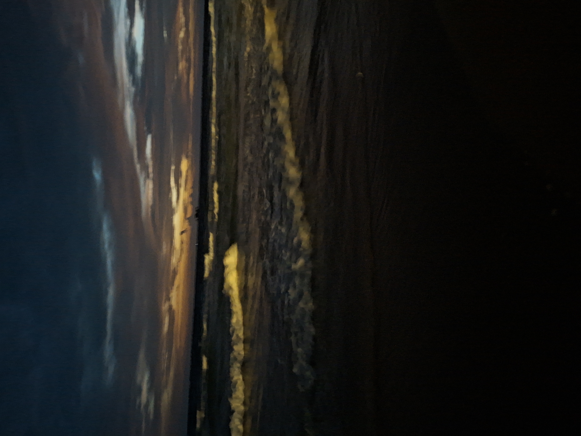 Beach at dusk, sky cycling through sunset colors into night