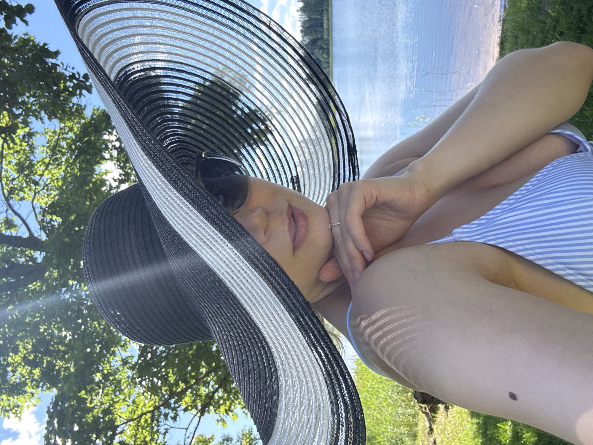 Summer day at a Latvian lake: paddleboarding, picnicking, fishing