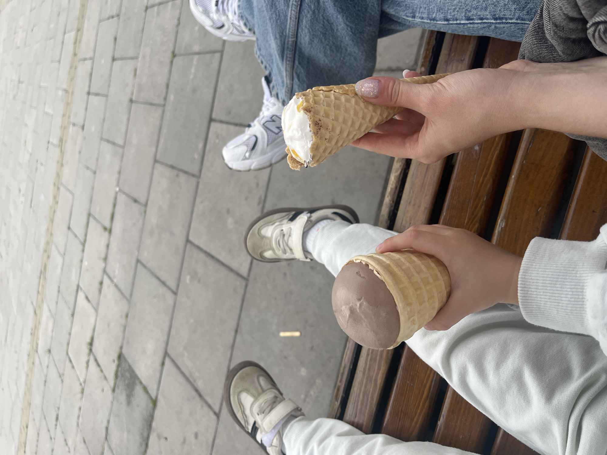 Mother and daughter enjoy afternoon ice cream outing in Chelyabinsk