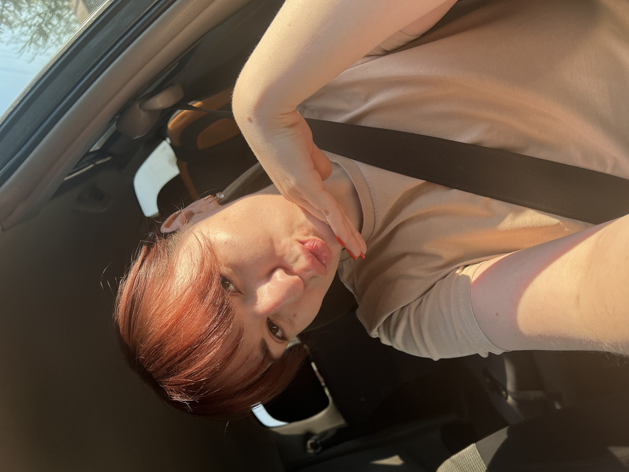 Red-haired person photographed inside car in Фоки, Russia
