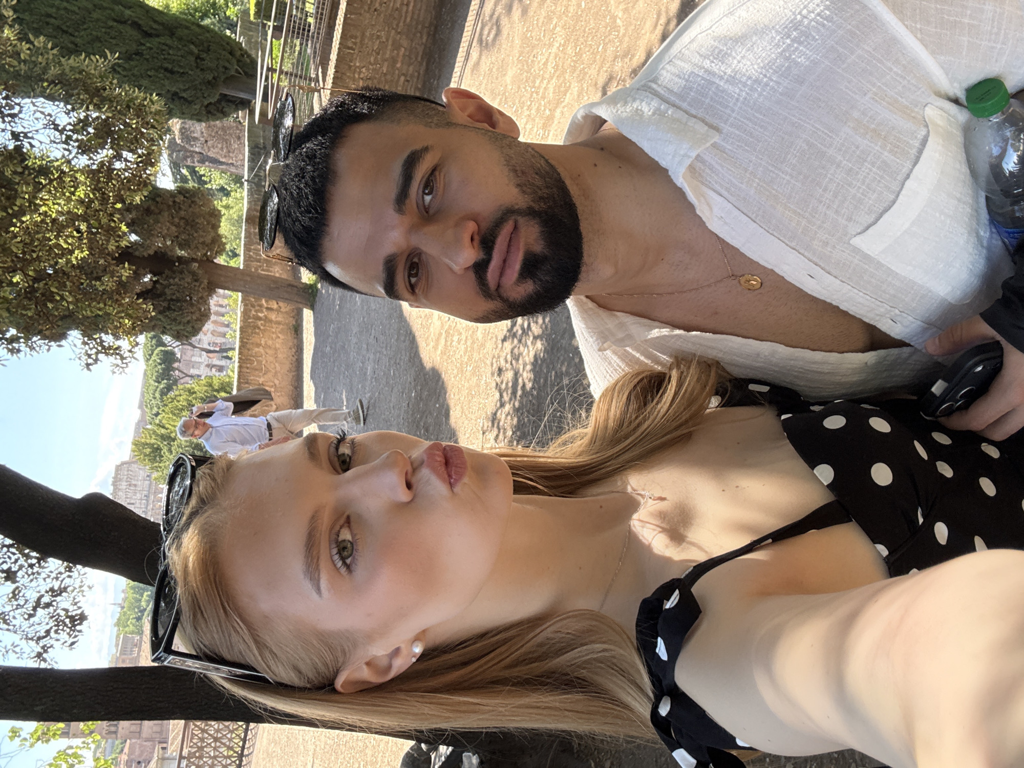 Couple tours Roman Forum and gardens during morning visit