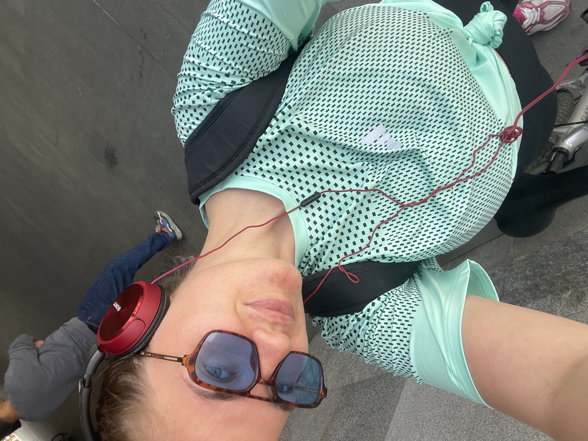 Woman takes playful selfies near Moscow railway terminal with cyclists