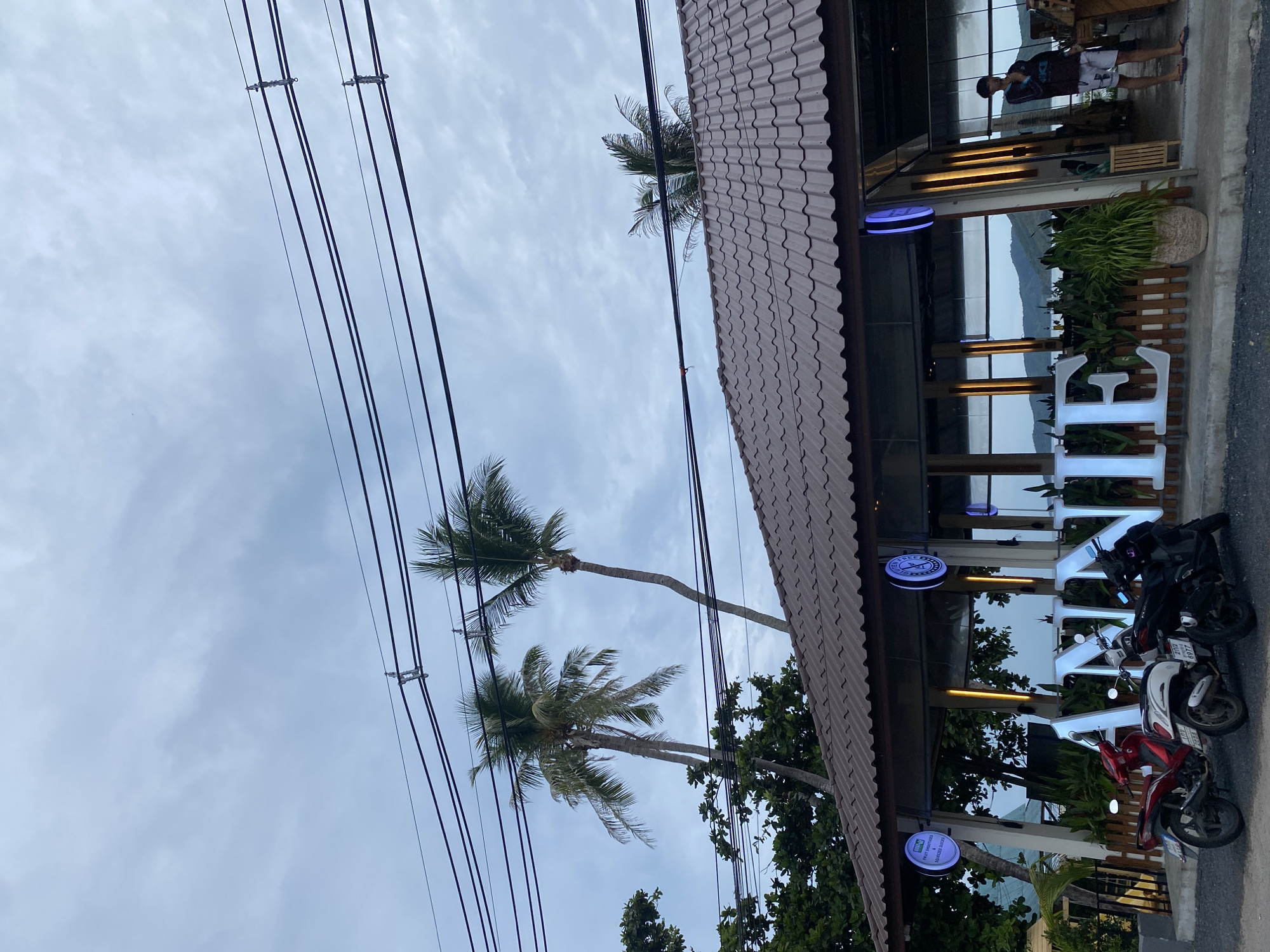 Tourist documents quiet coastal moments in Thai fishing village