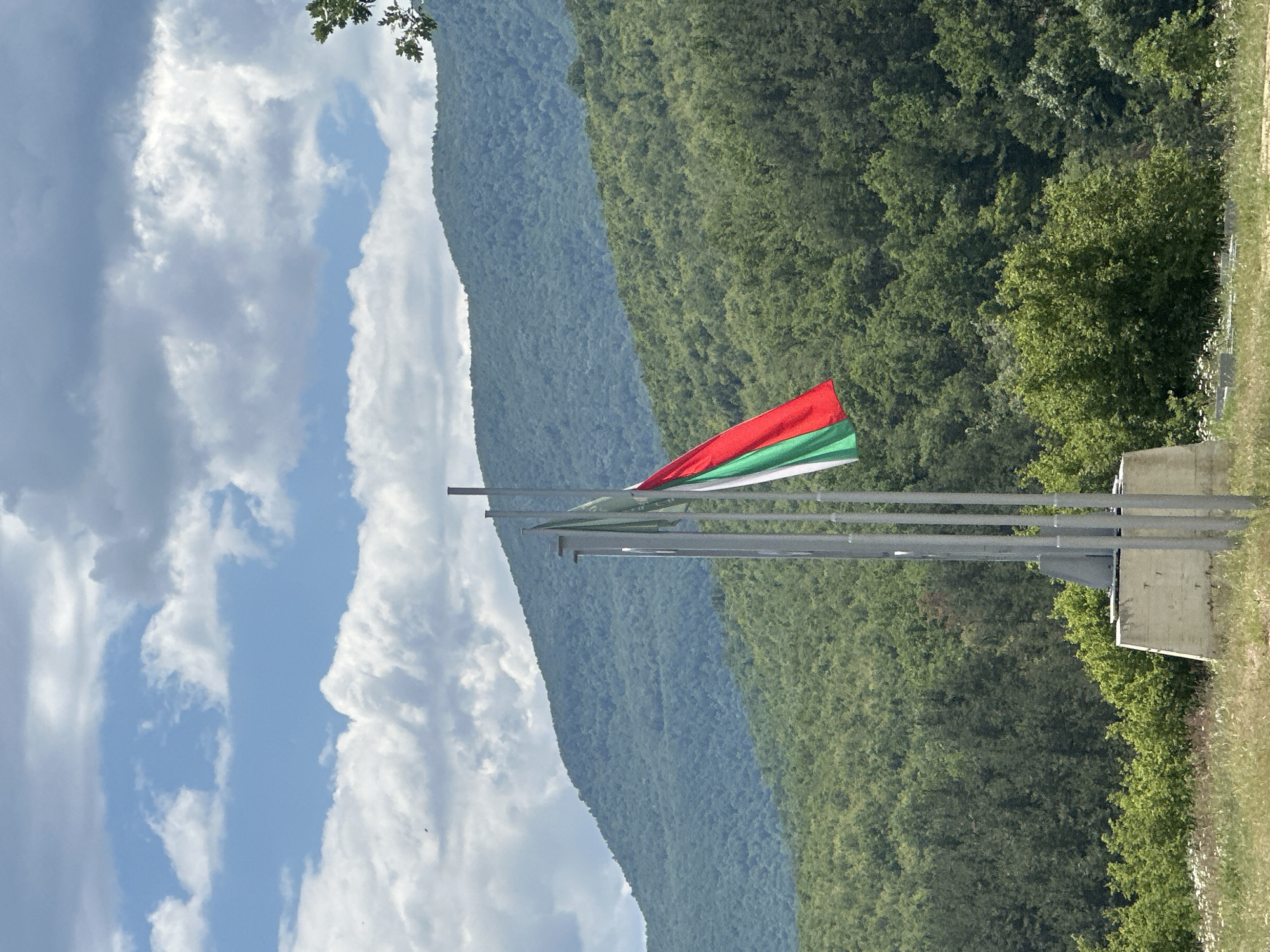 Bulgarian flag flies over mountain landscape in Patalenitsa