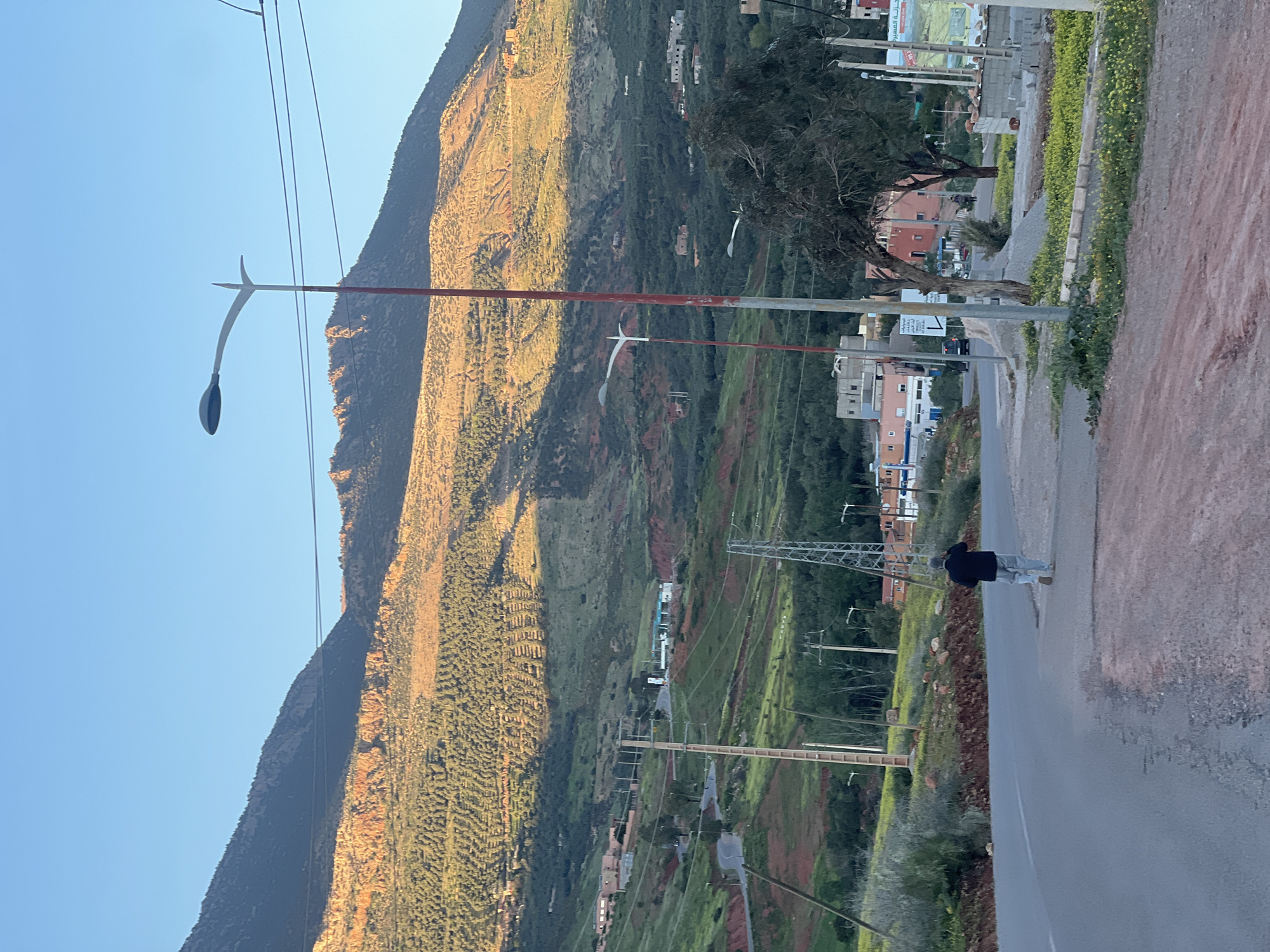 Daytime moon visible over Ouaouizert Morocco mountain landscape