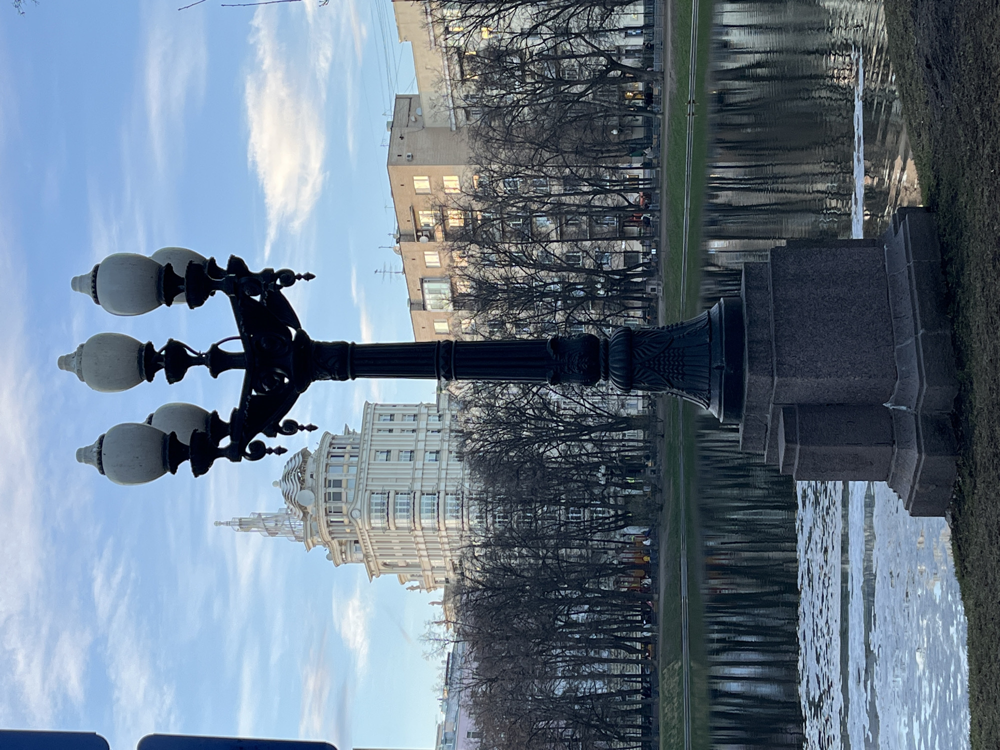 Moscow street scene shows ornate lamppost near water