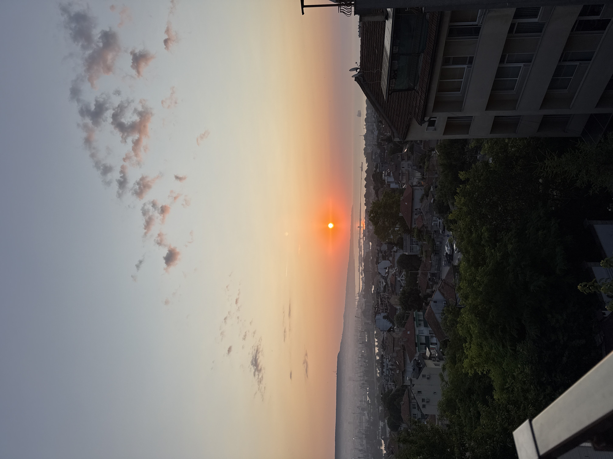 Varna from above at sunrise, golden light across the city.