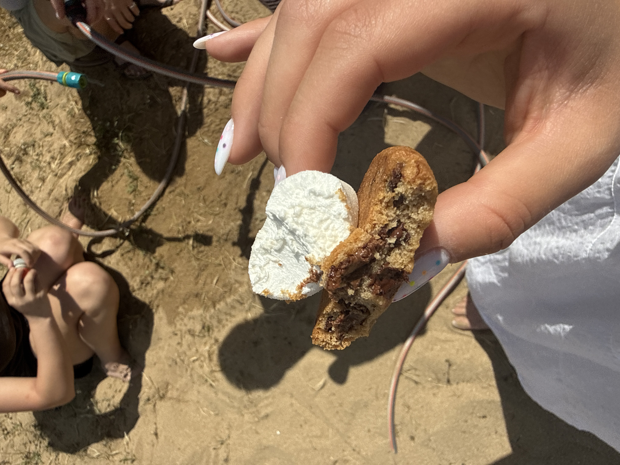 Person enjoys decorated desserts in Bulgarian coastal town