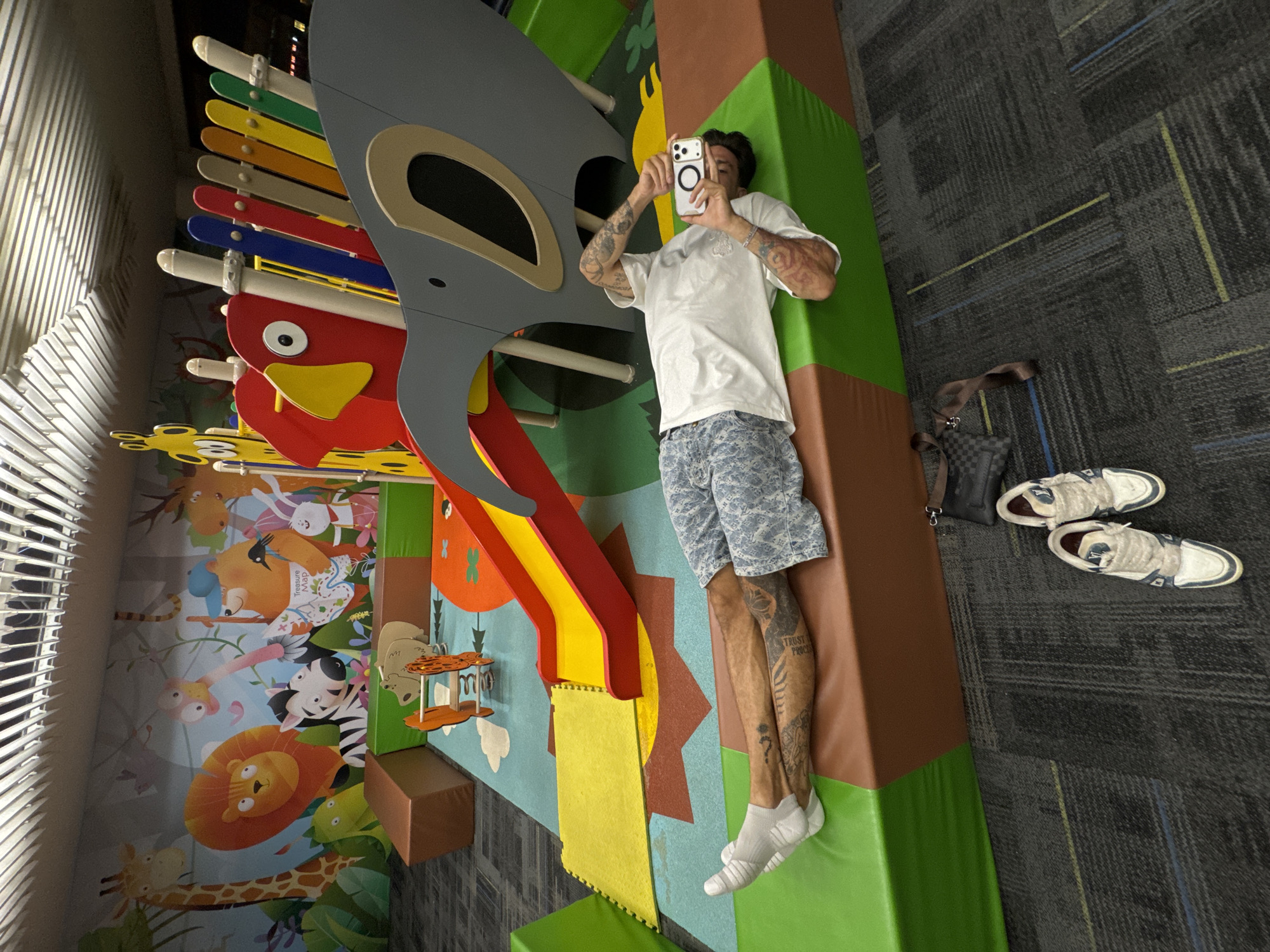 Adult Takes Photos on Playground Equipment in Bangkok
