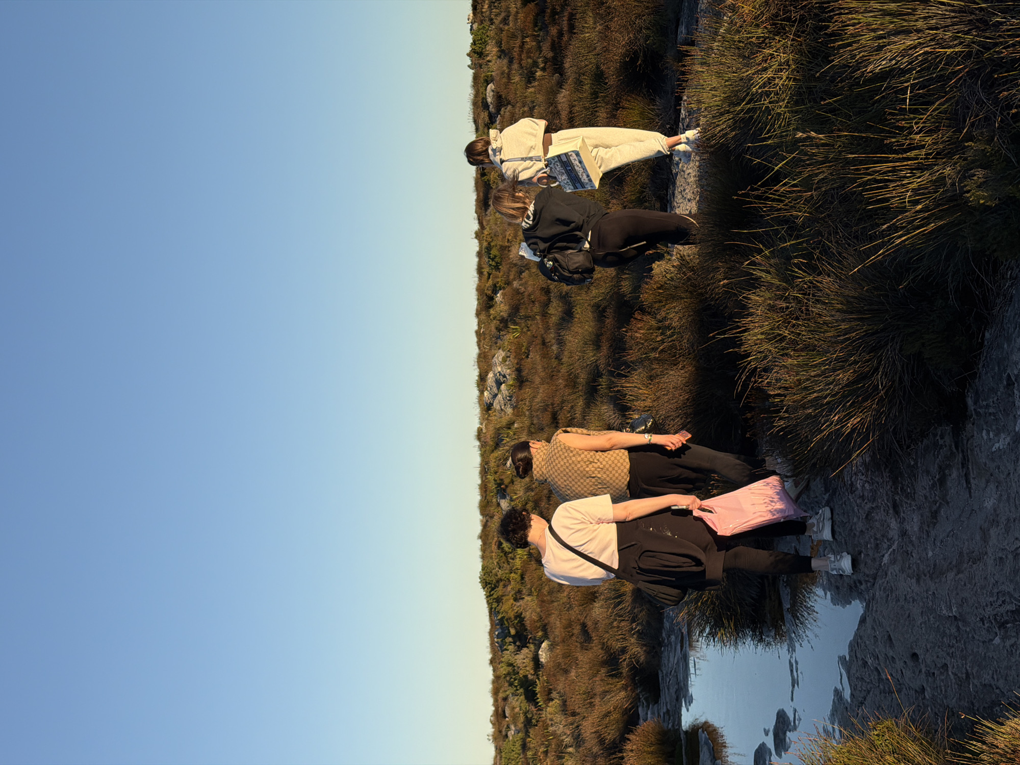 Group explores rocky Cape Town terrain with natural pools
