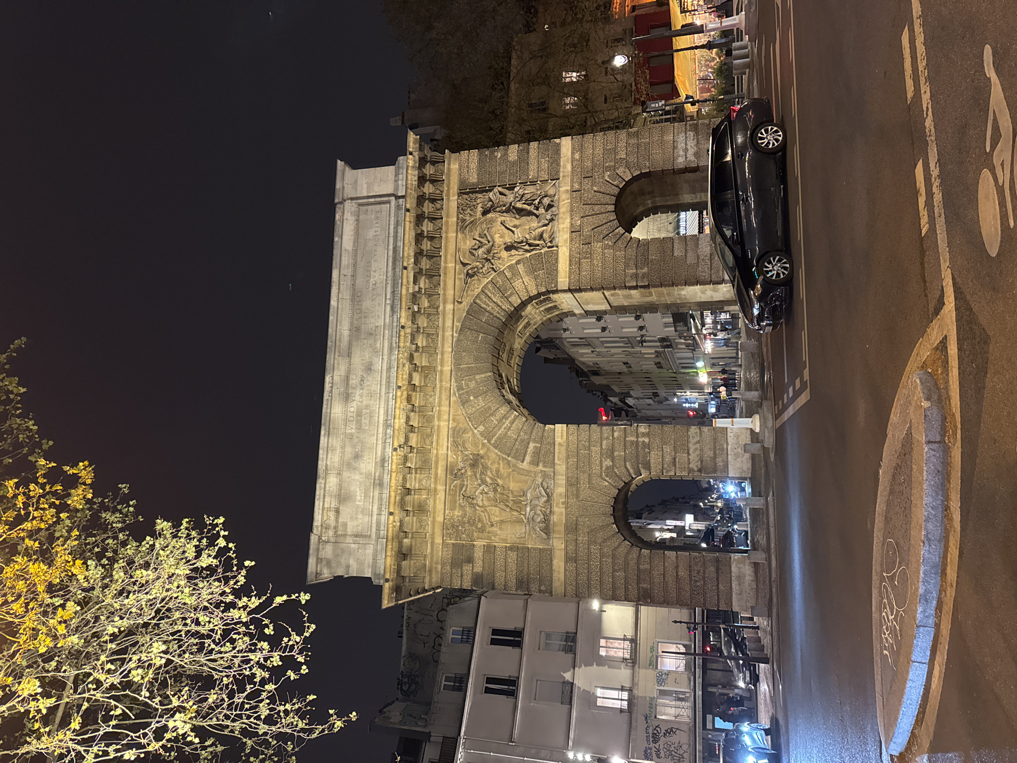 Porte Saint-Denis triumphal arch photographed at night in Paris