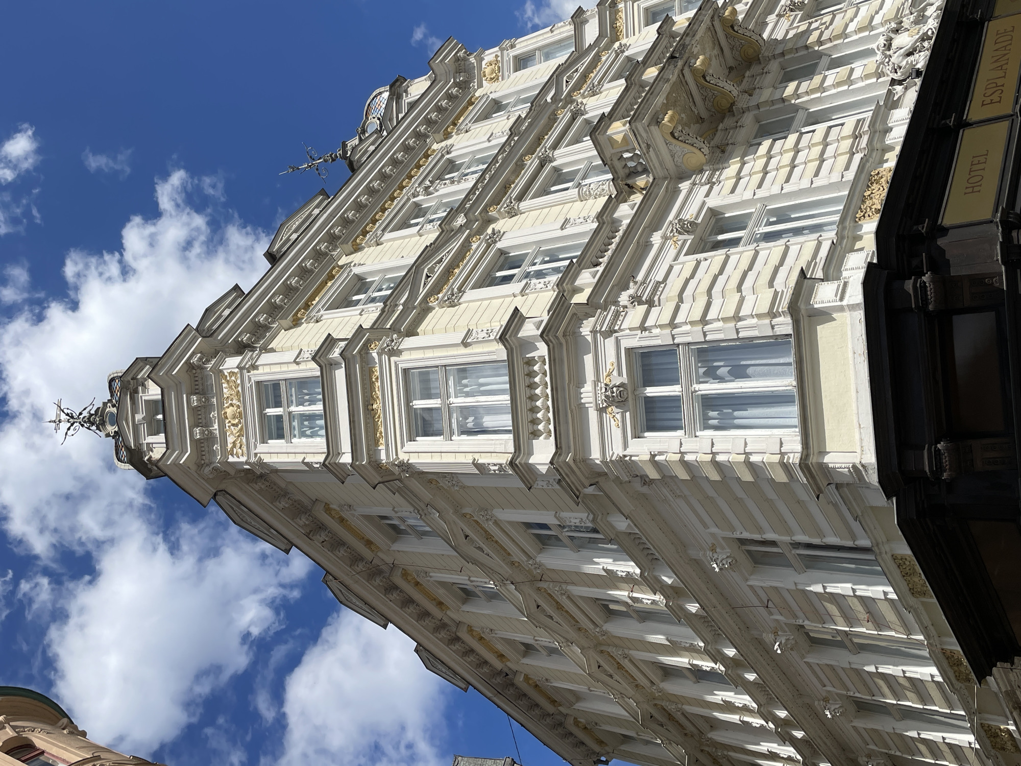 Walking a European city's ornate streets on a summer morning