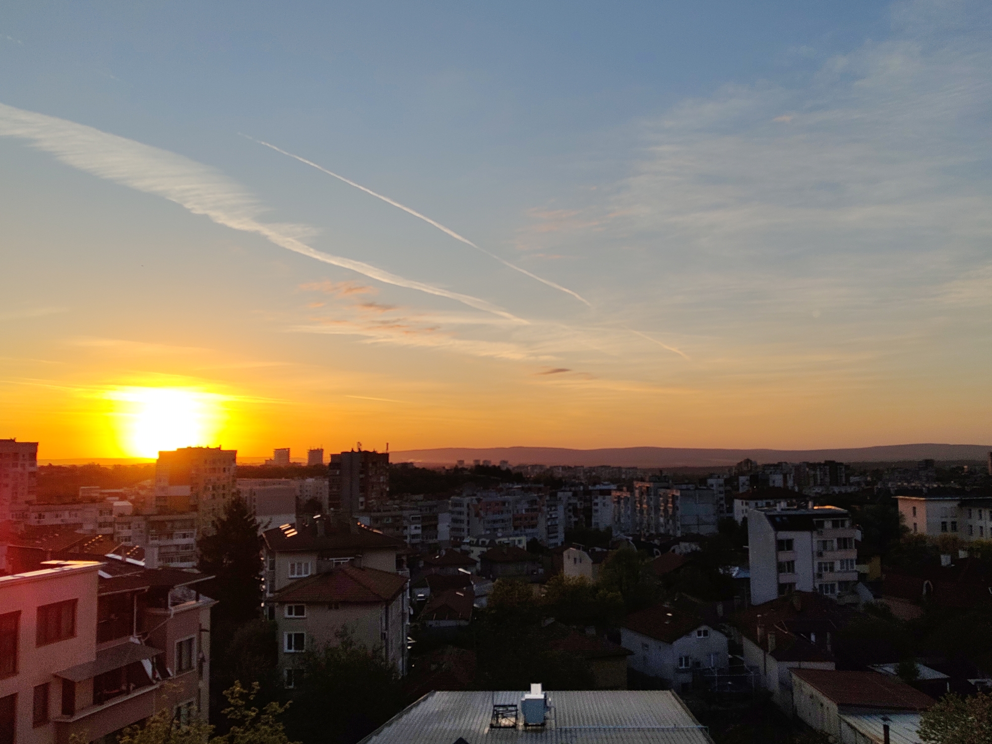 Sunset observed over Shumen, Bulgaria with contrails visible