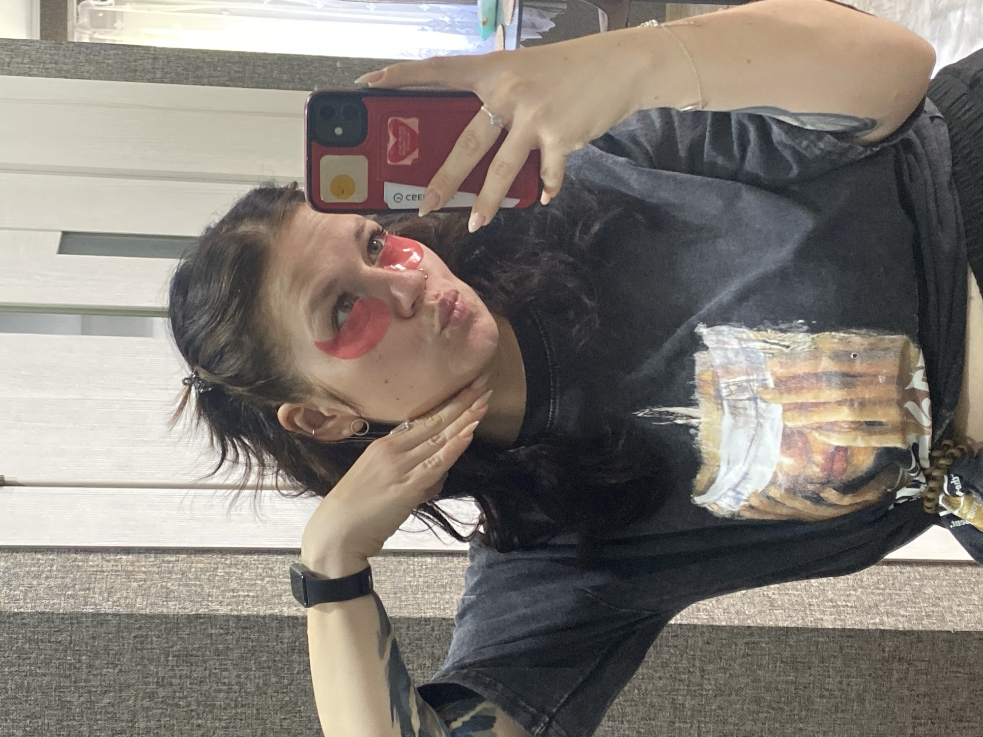 Woman takes selfie with red eye patches in Chaikovsky