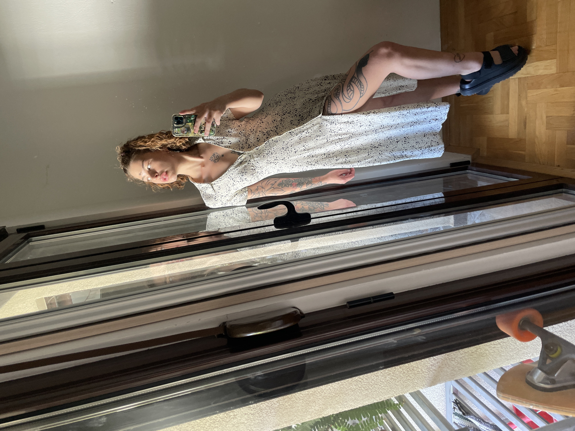 Woman takes mirror selfies with sleeping dog in Montenegro home