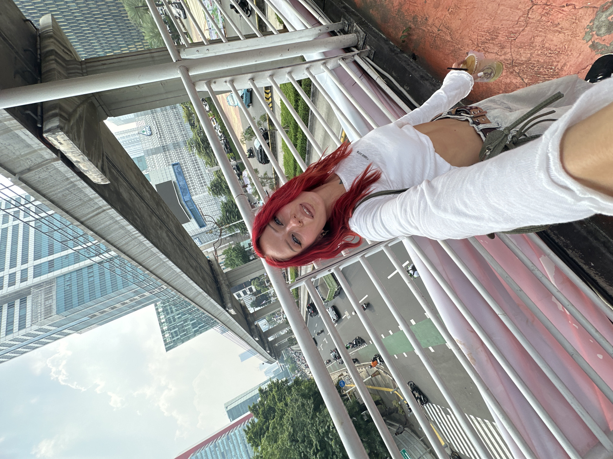 Red-haired woman takes selfies across South Jakarta locations