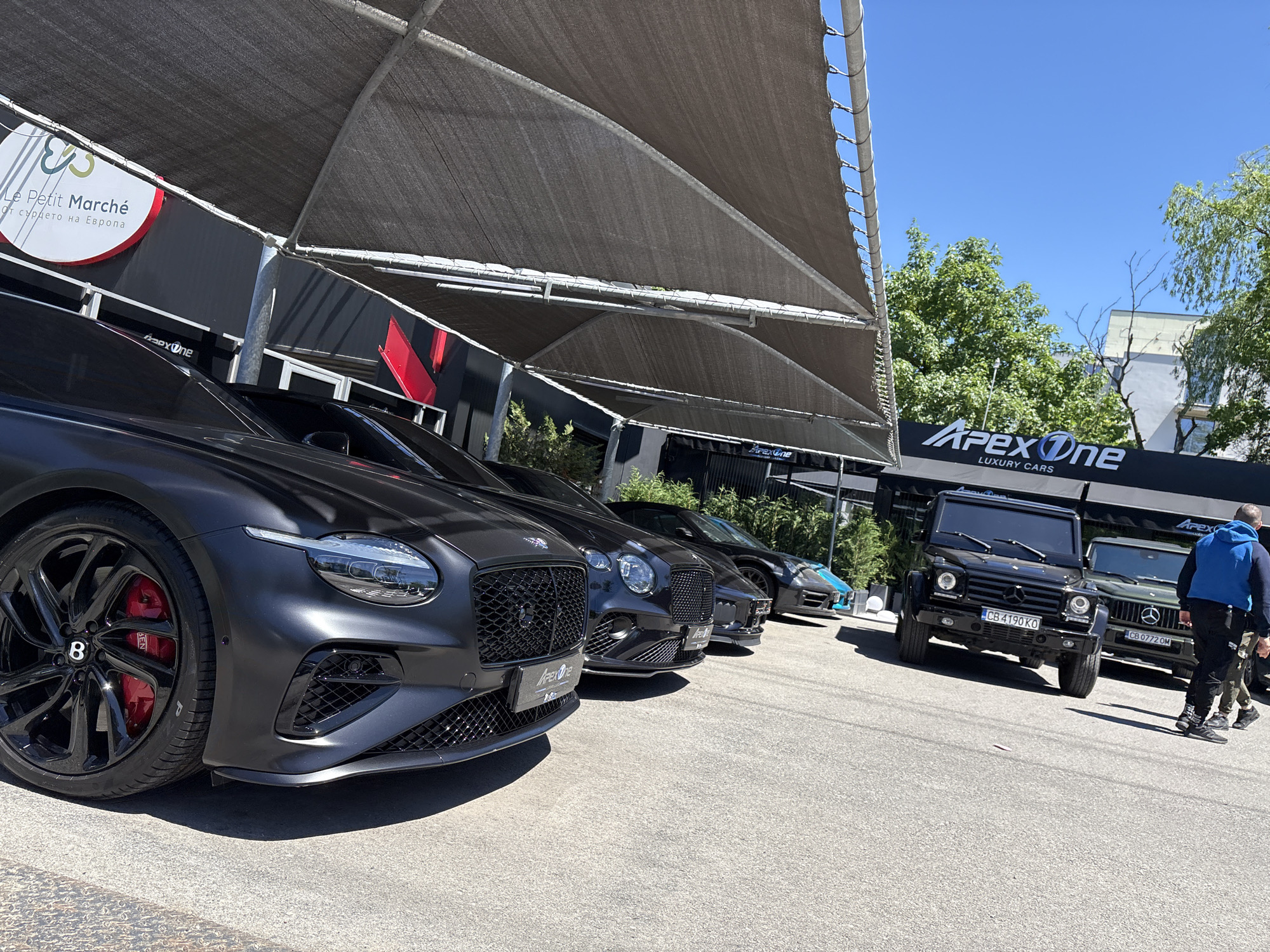 Morning scenes captured across Sofia include luxury cars, street art