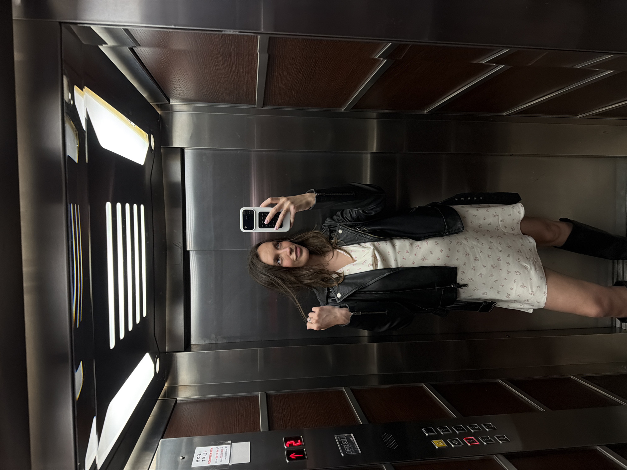 Woman photographed in elevator and outdoors in Budva
