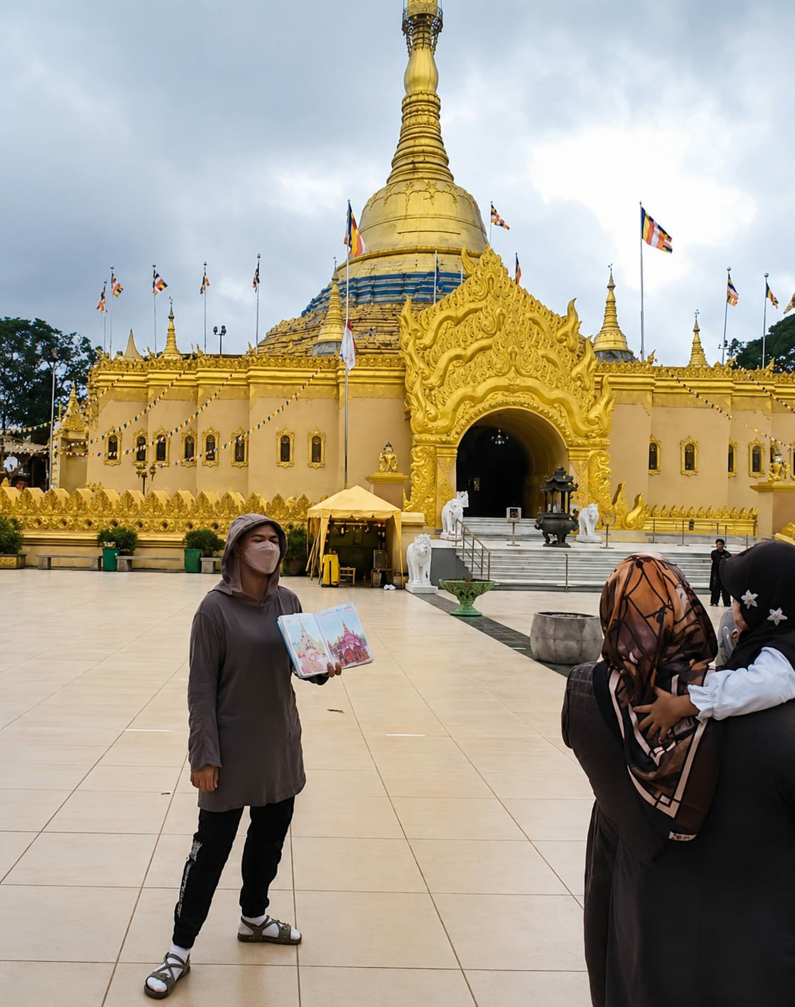 Inside and outside a golden Buddhist temple in Dolat Rayat