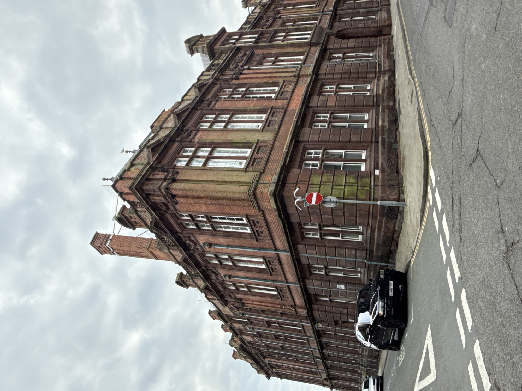 Red brick building and parked car documented in Great Yarmouth
