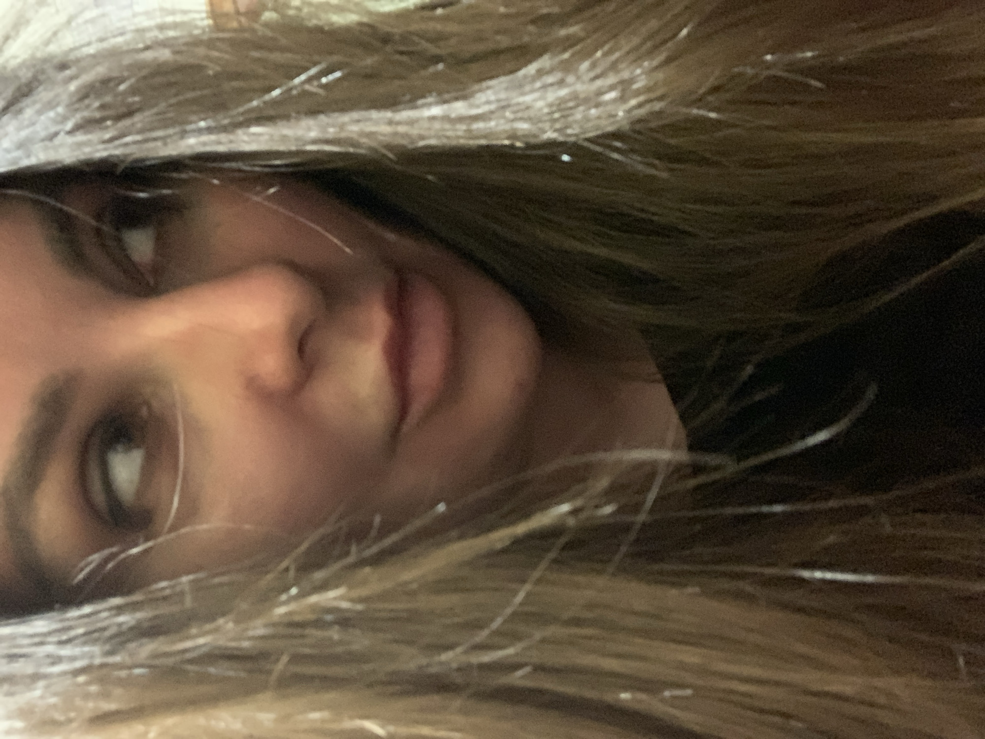 Close-up portraits with partially obscured faces, location unknown