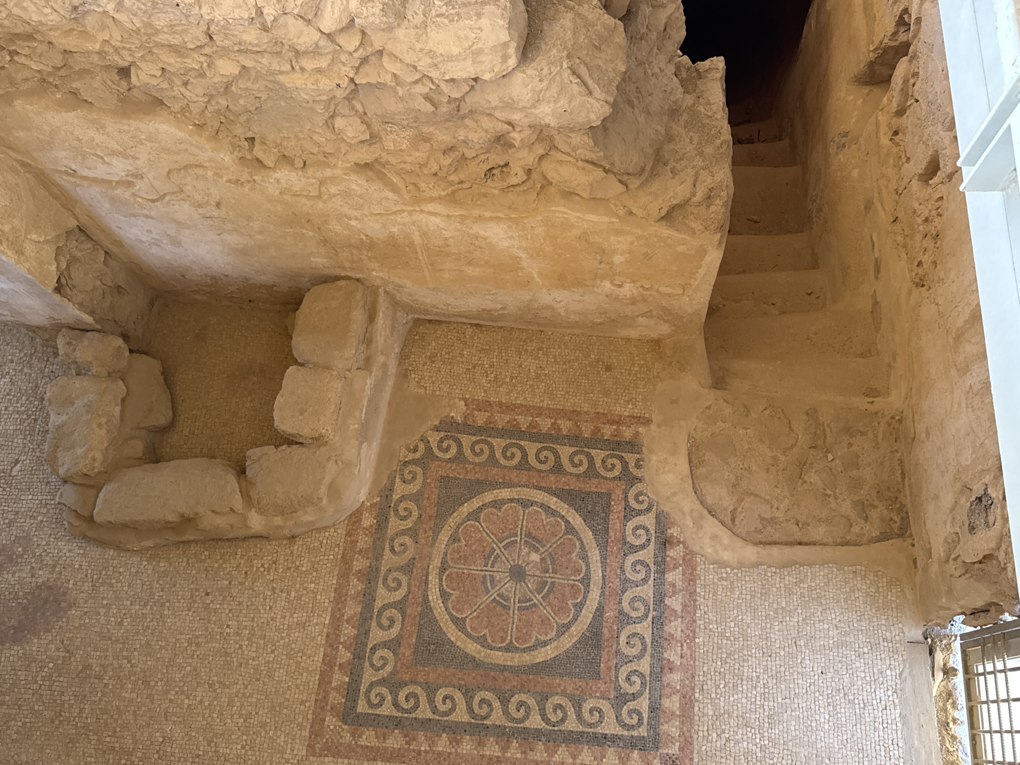 Overhead look at an ornate ancient geometric mosaic floor