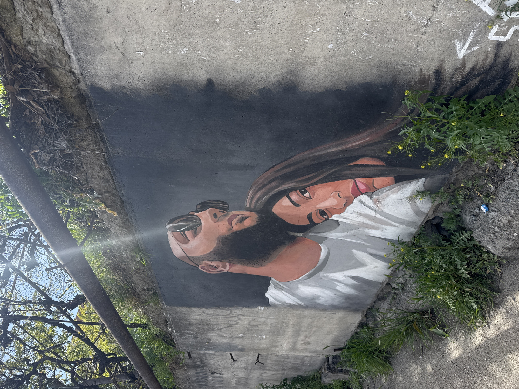 Portrait mural of two people documented in Tbilisi