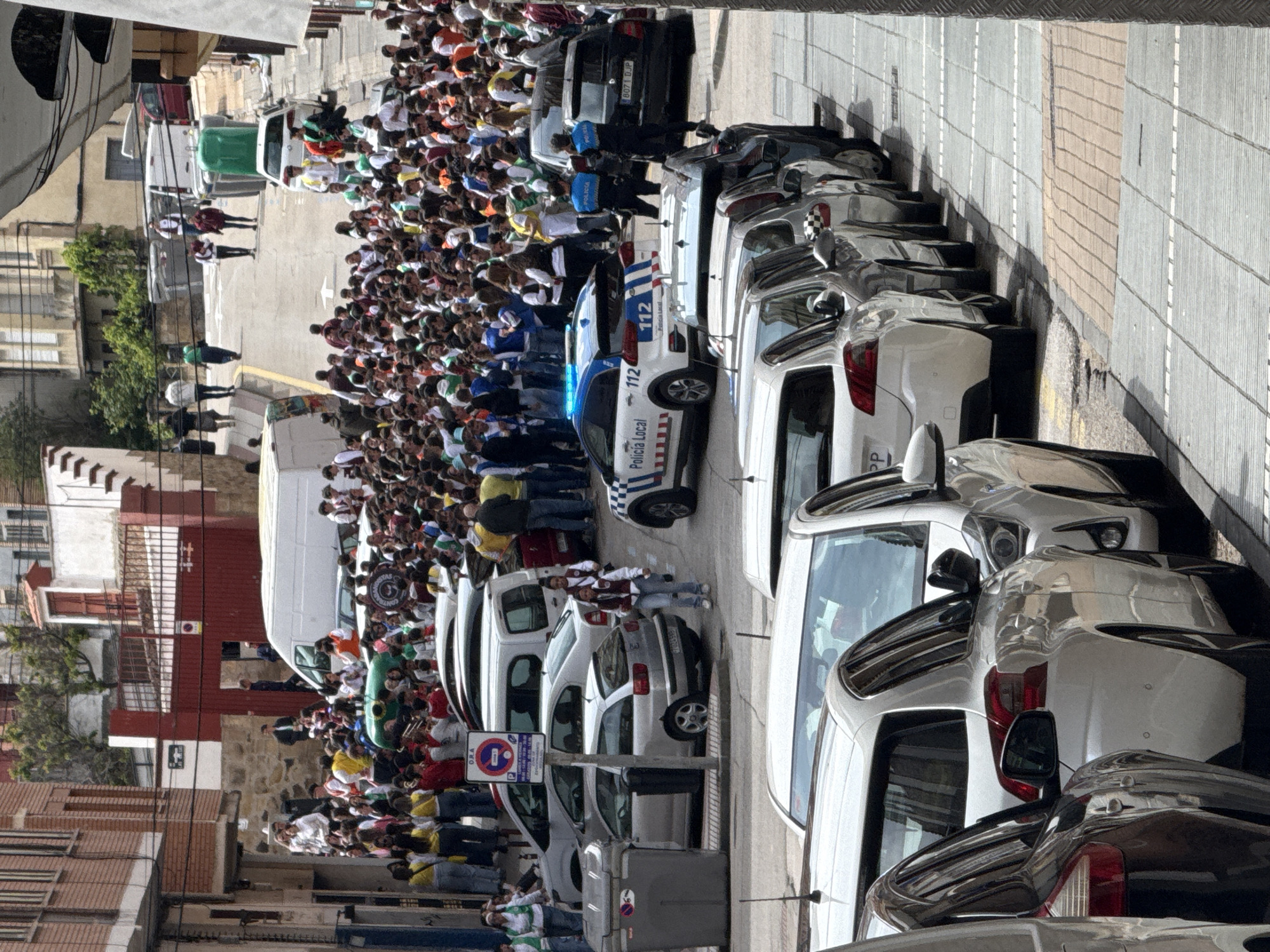 Festive crowd gathers on street in Soria, Spain