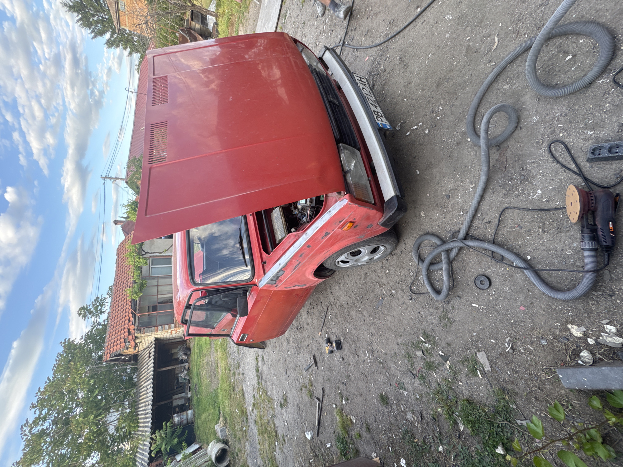 Red Lada undergoes repairs in Bulgarian village garage