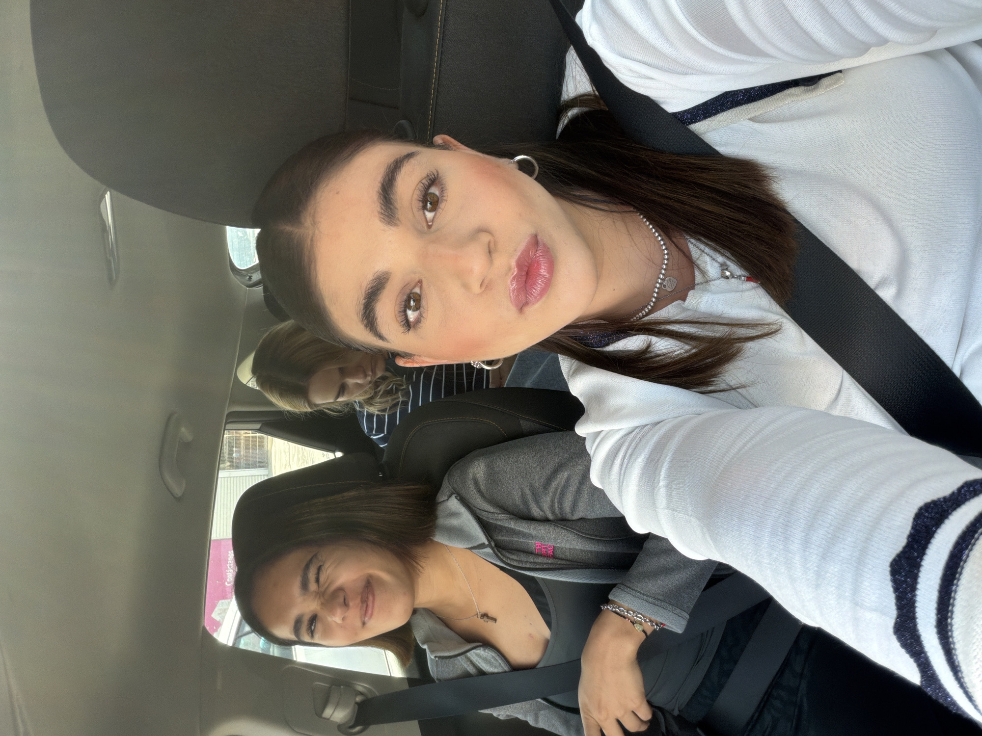 Three women take selfies in car in Puebla