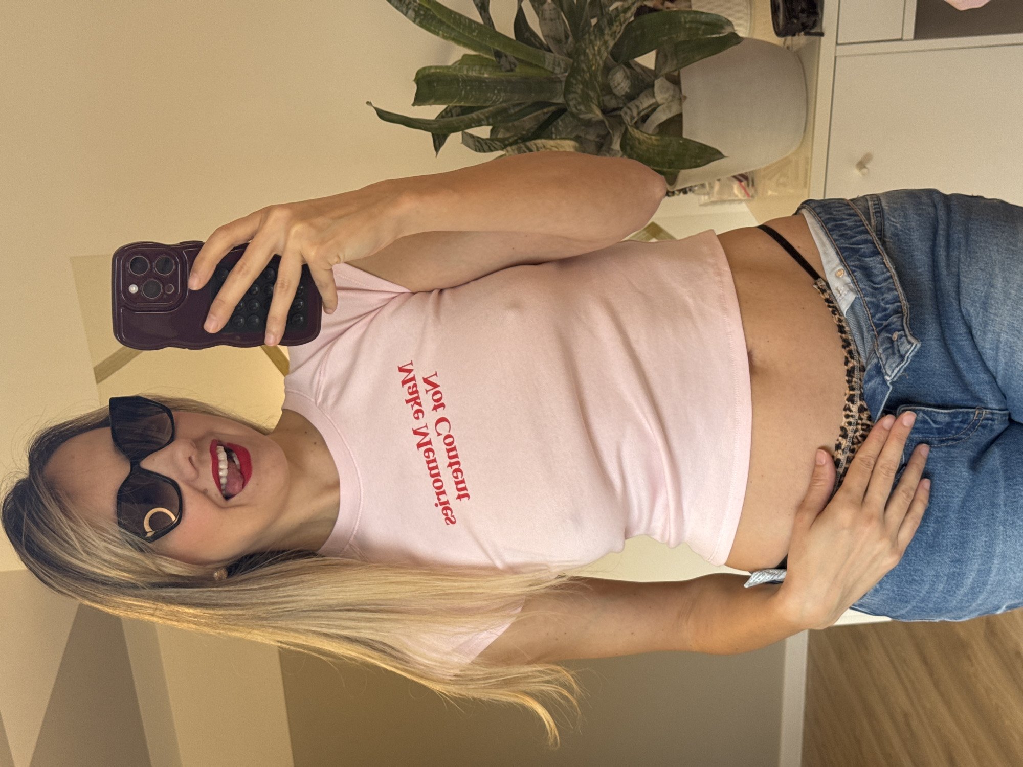 Woman photographs selfies indoors in Carnikava, Latvia