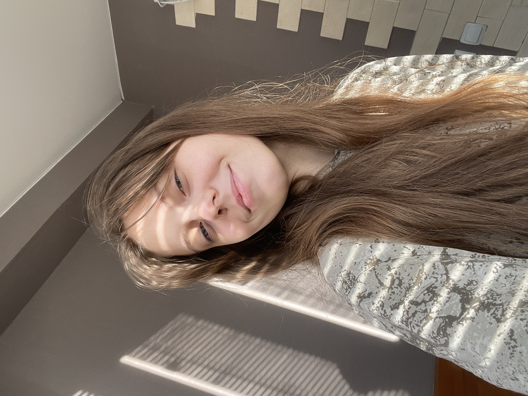 Woman's quiet morning moments documented in Ufa apartment