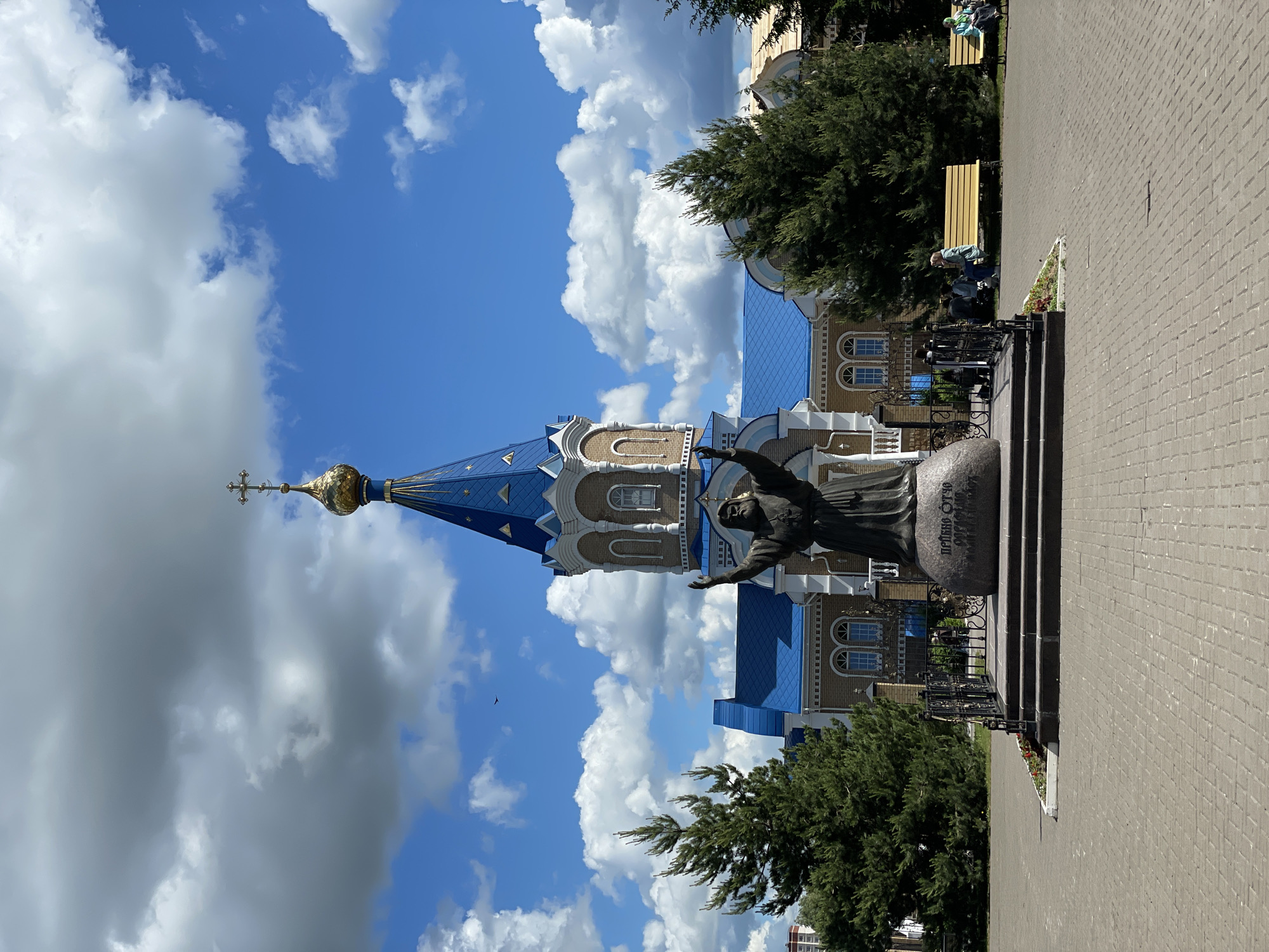 Mother and child visit church in Izhevsk on sunny morning