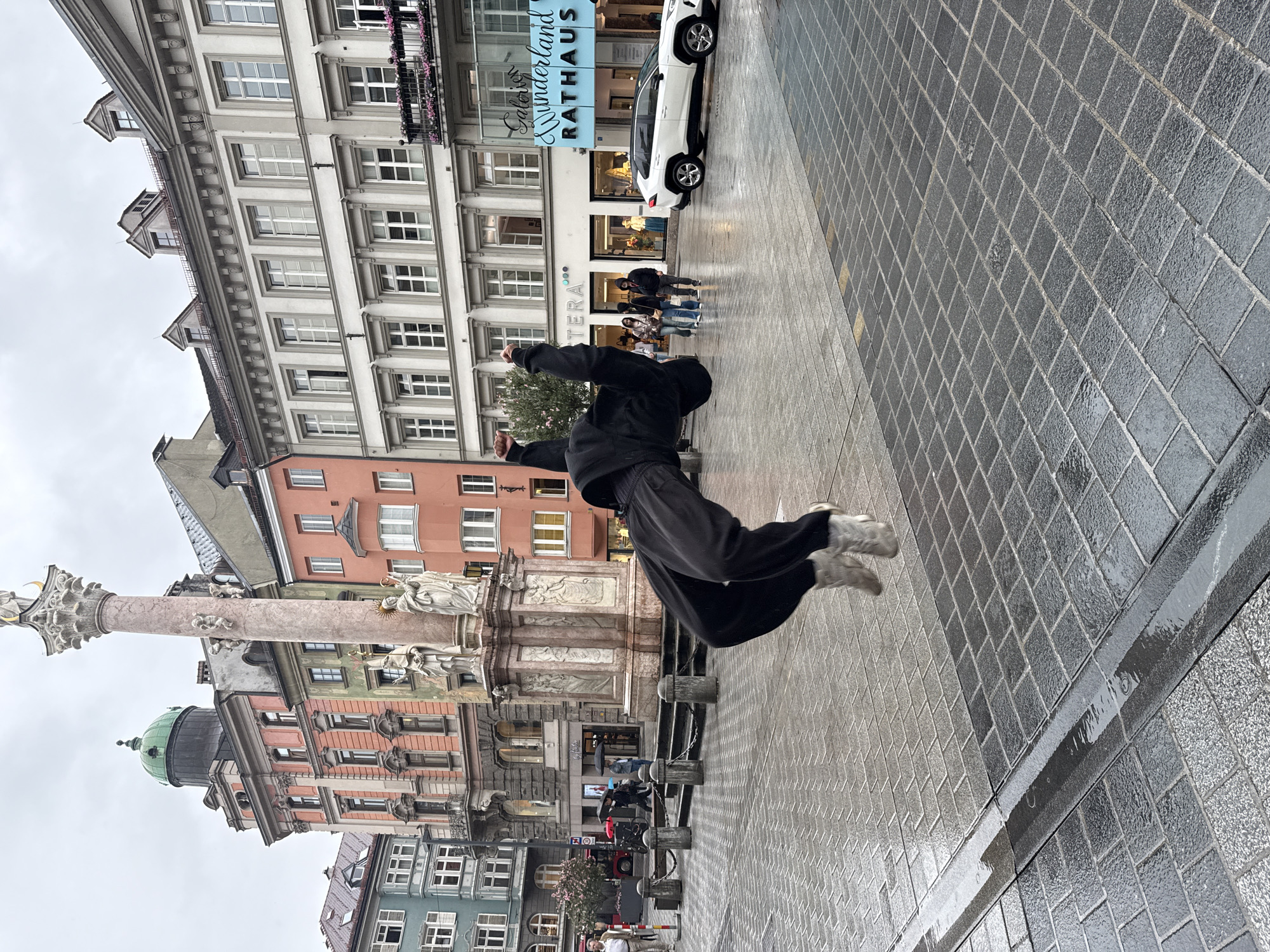 Street performer executes flips in rainy Innsbruck square